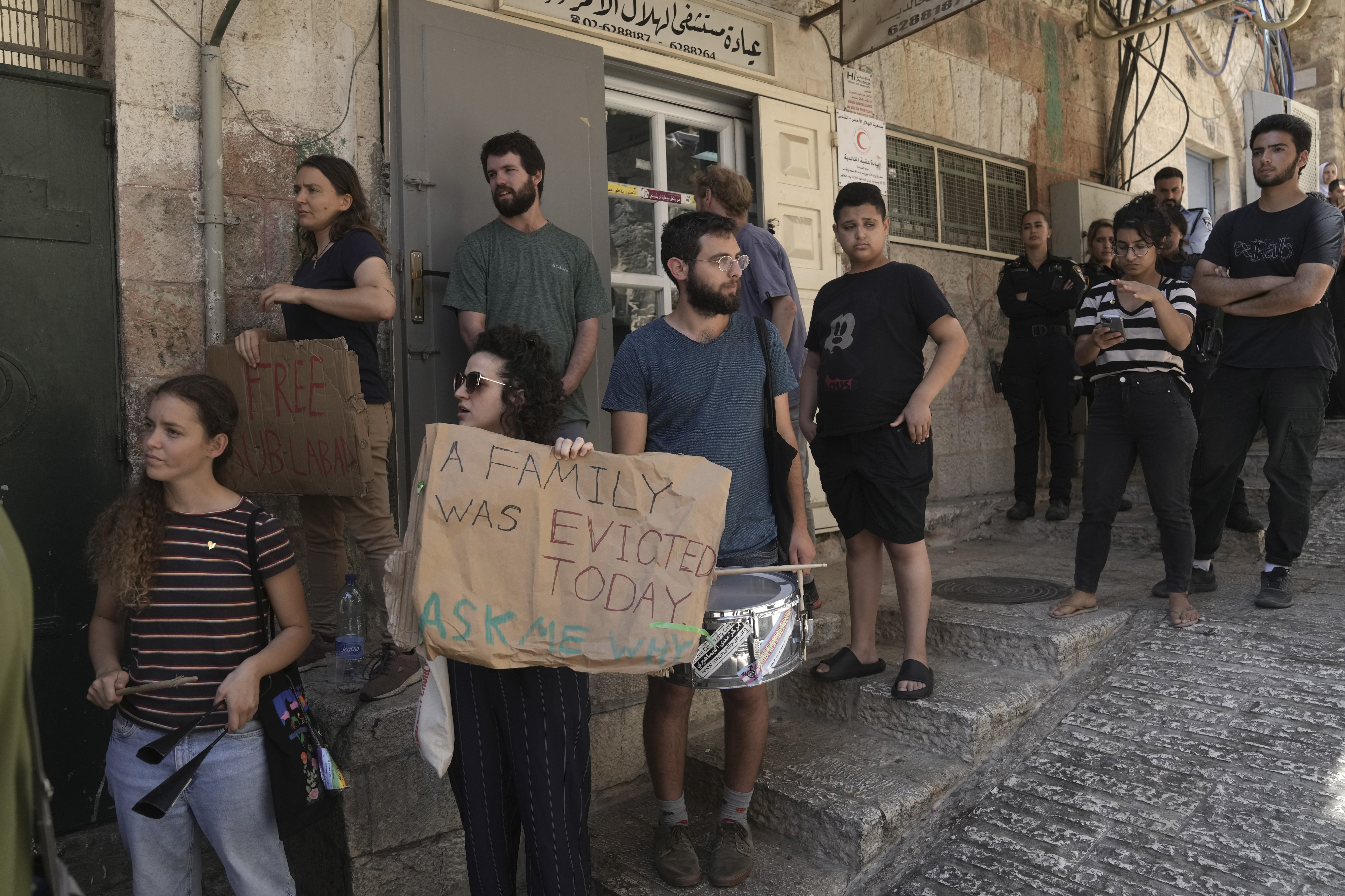 Activists gather outside of Nora Ghaith-Sub Laban's home after their eviction 