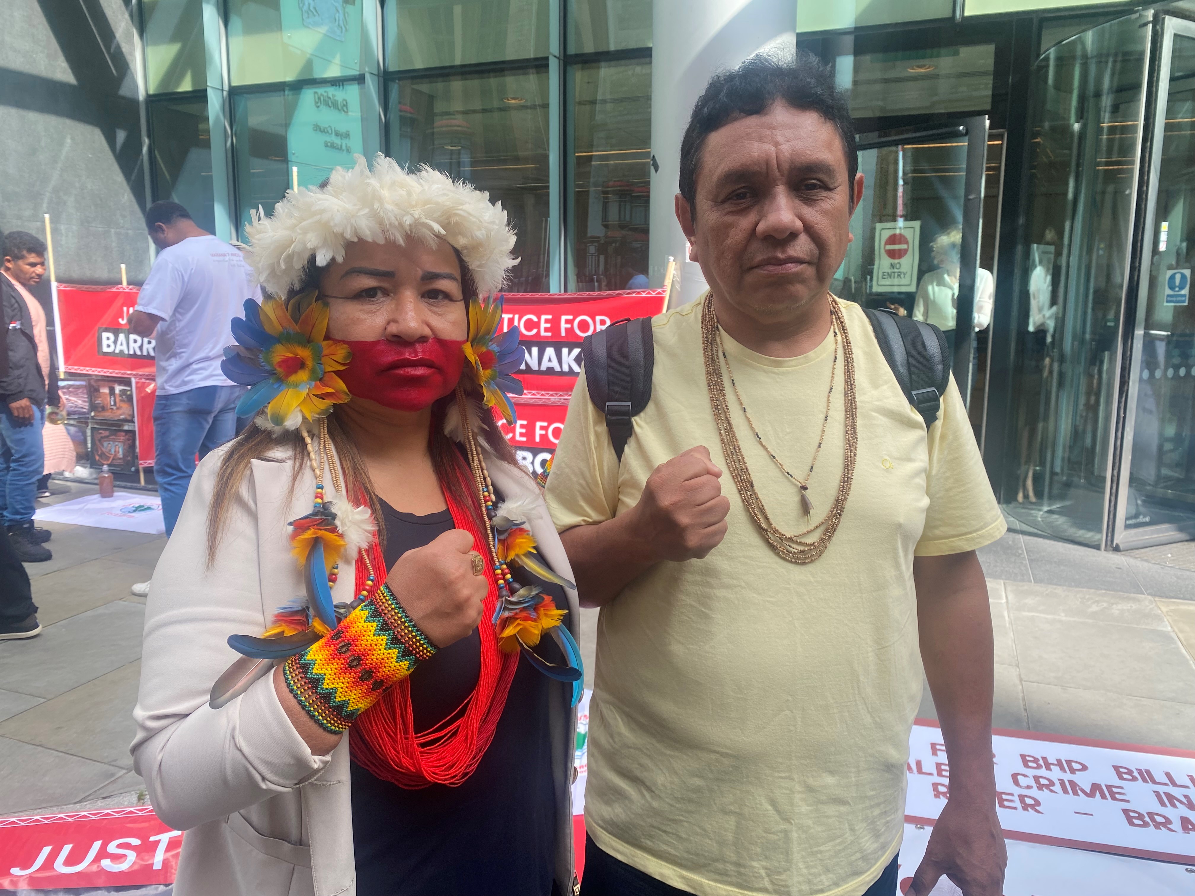 Dirlene Krenak and Rondon Krenak protest outside the Technology and Construction court in London