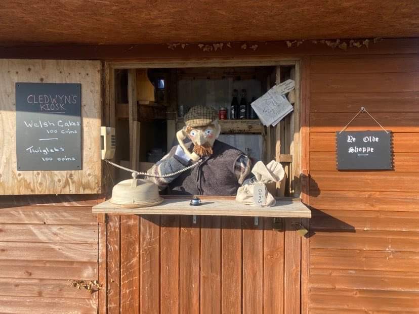 A scarecrow figure of Cledwyn inside his kiosk from I'm A Celebrity...Get Me Out Of Here!