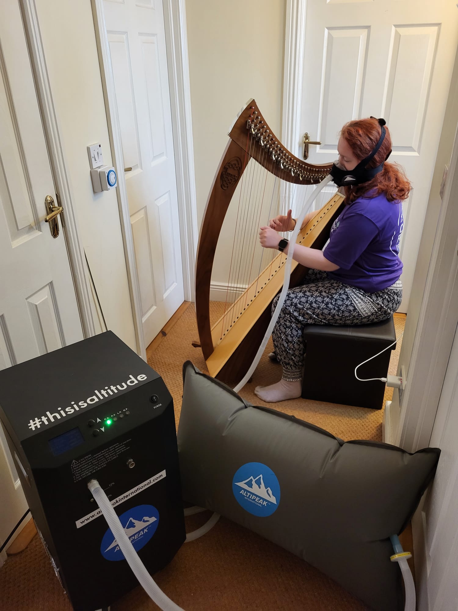 Woman using machine and sitting down 