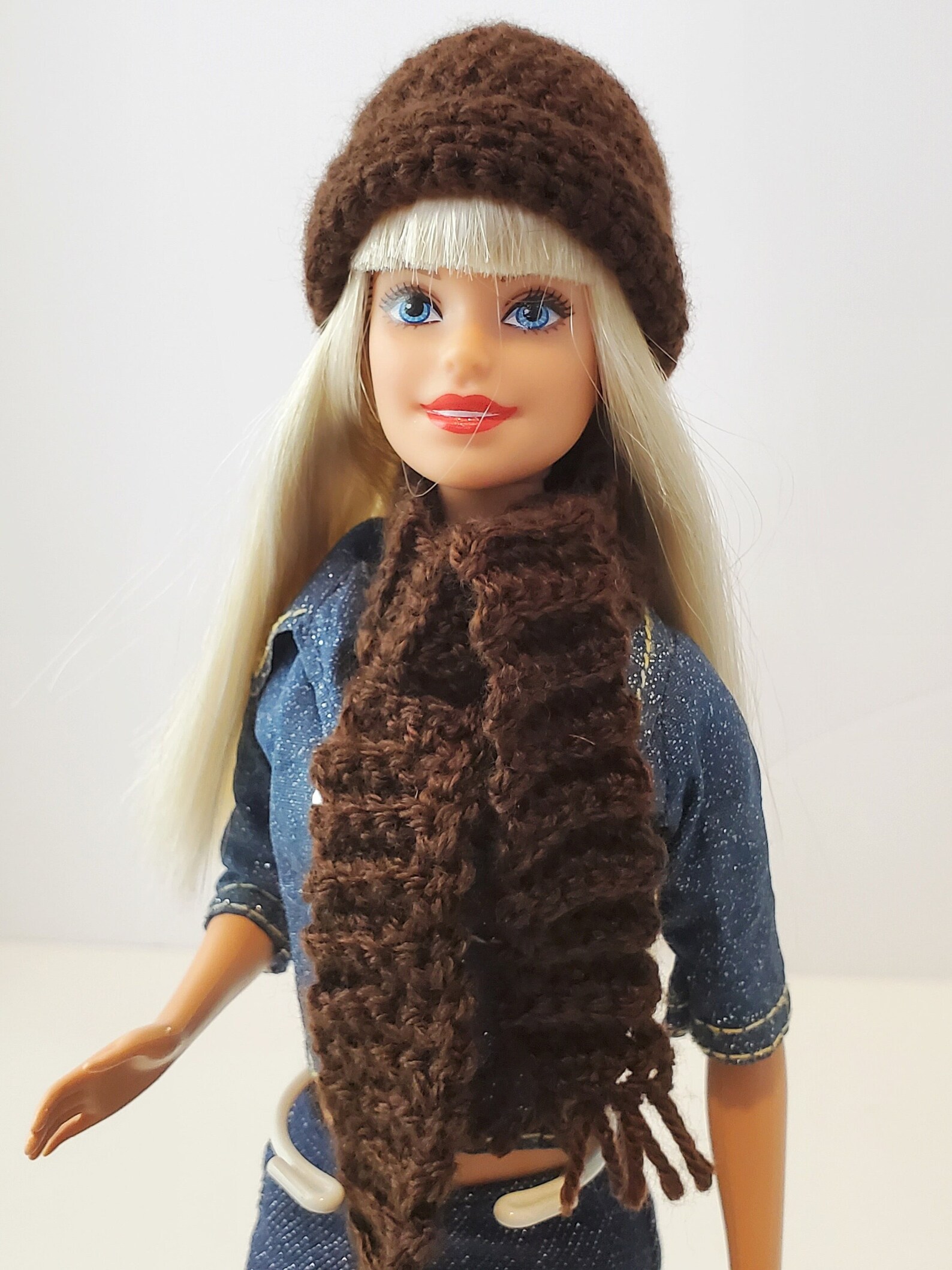 Crocheted hat and scarf on doll