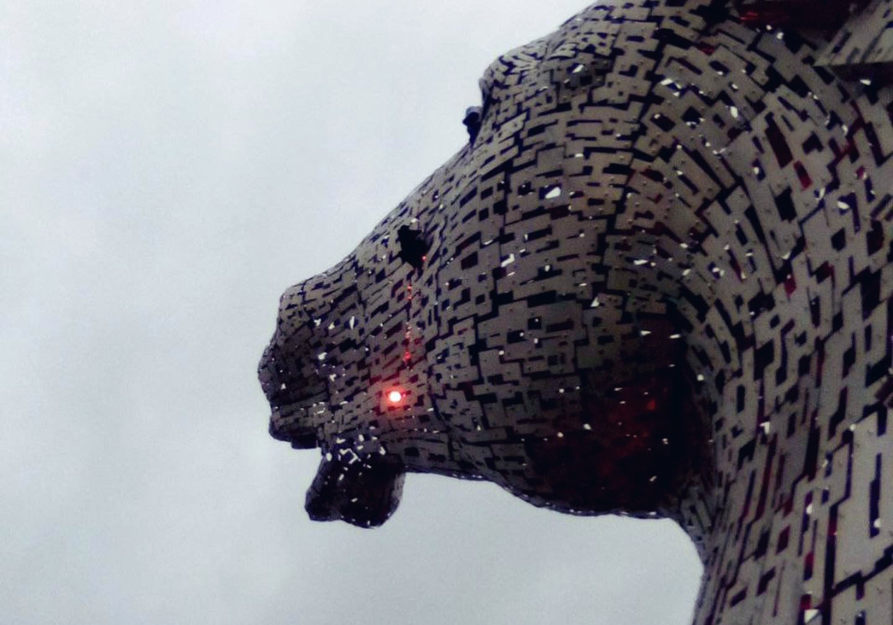 Activists scale The Kelpies statue between Falkirk and Grangemouth