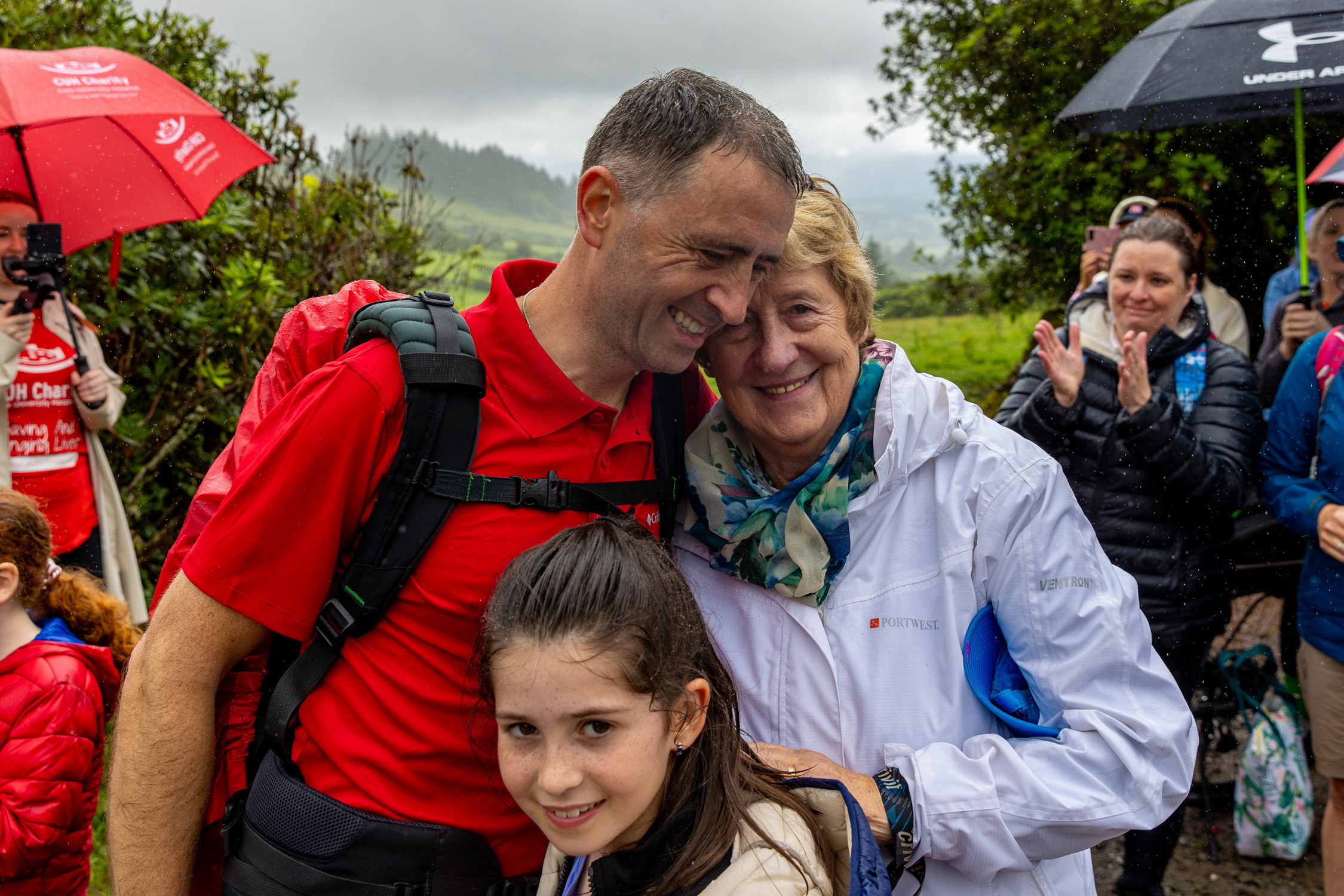 Dr Richard Horgan, is embraced by Orla Gosnell's mum Myriam after making his final descent from Galtymore 