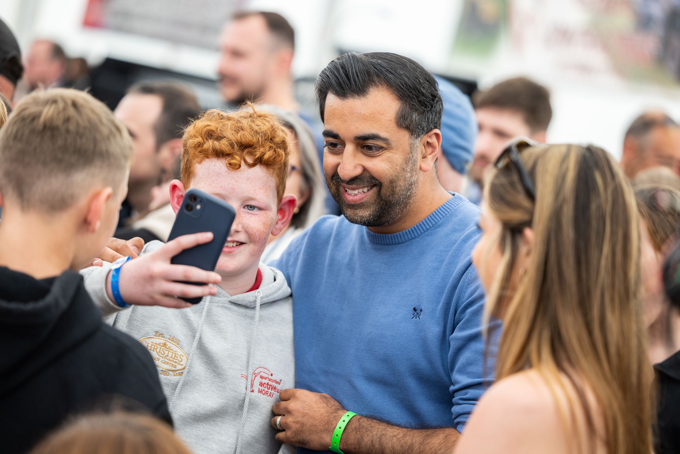 Humza poses for a selfie with a fan at Speyfest.