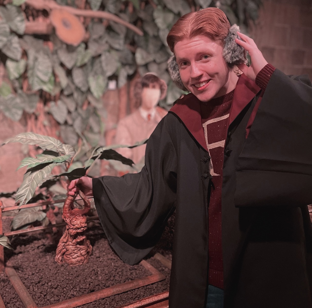 Man posing with Harry Potter gear 