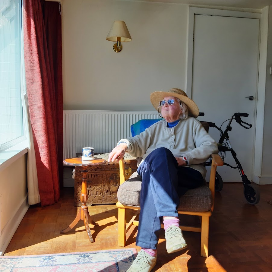 Woman sitting down and looking out of the window