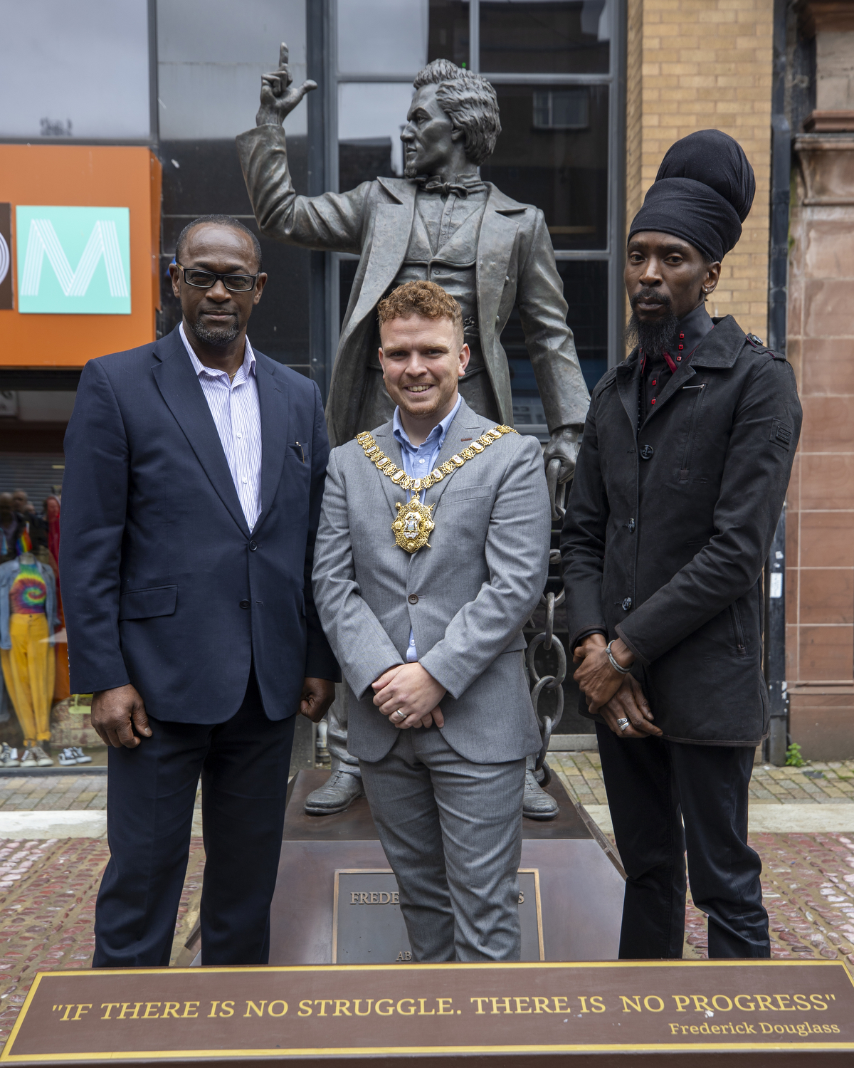 Councillor Ryan Murphy, centre, with Livingstone Thompson, left, and Tukura Makoni, from the African and Caribbean Support Organisation Northern Ireland