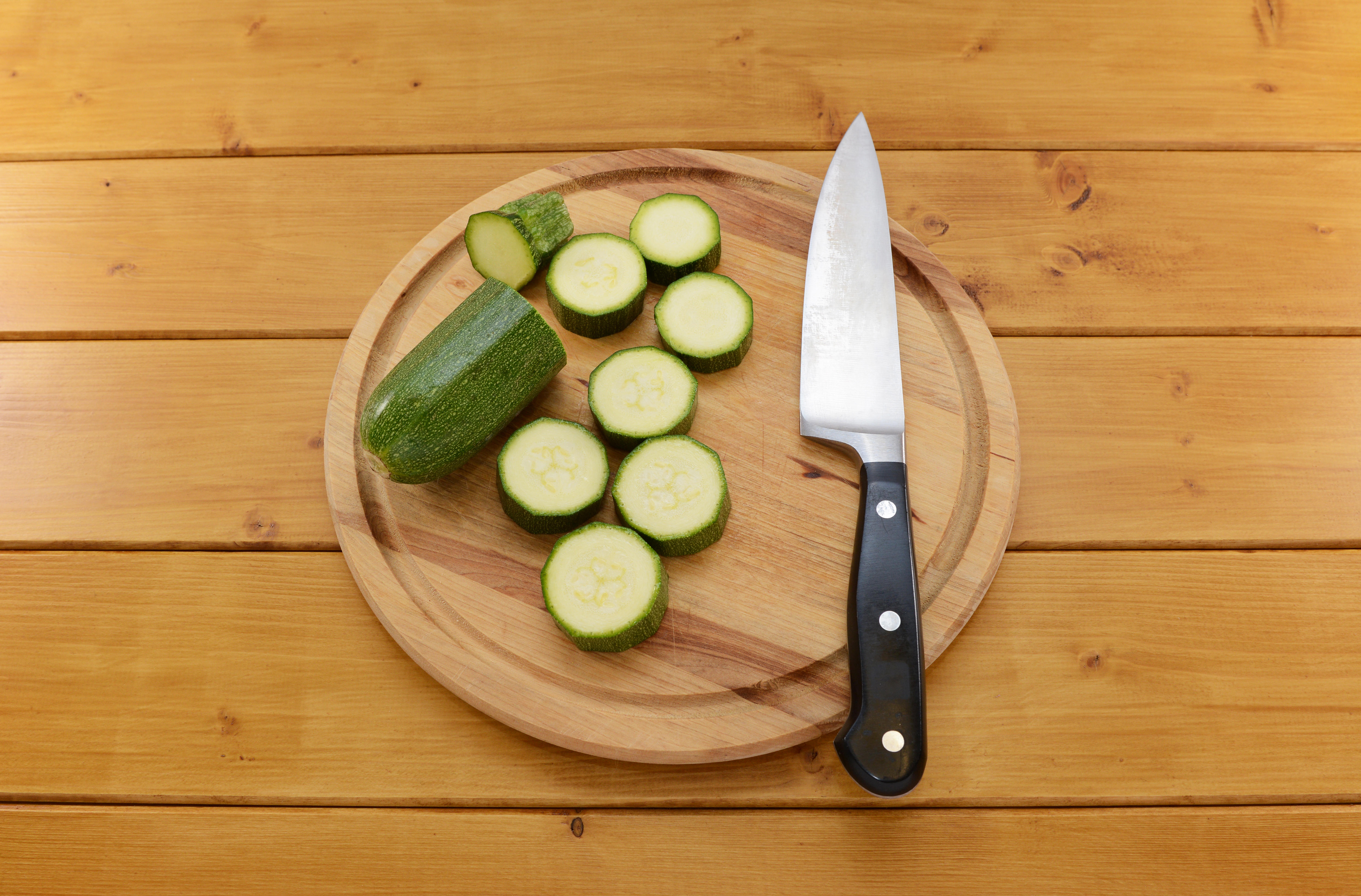 Courgettes on a chopping board (Alamy/PA)