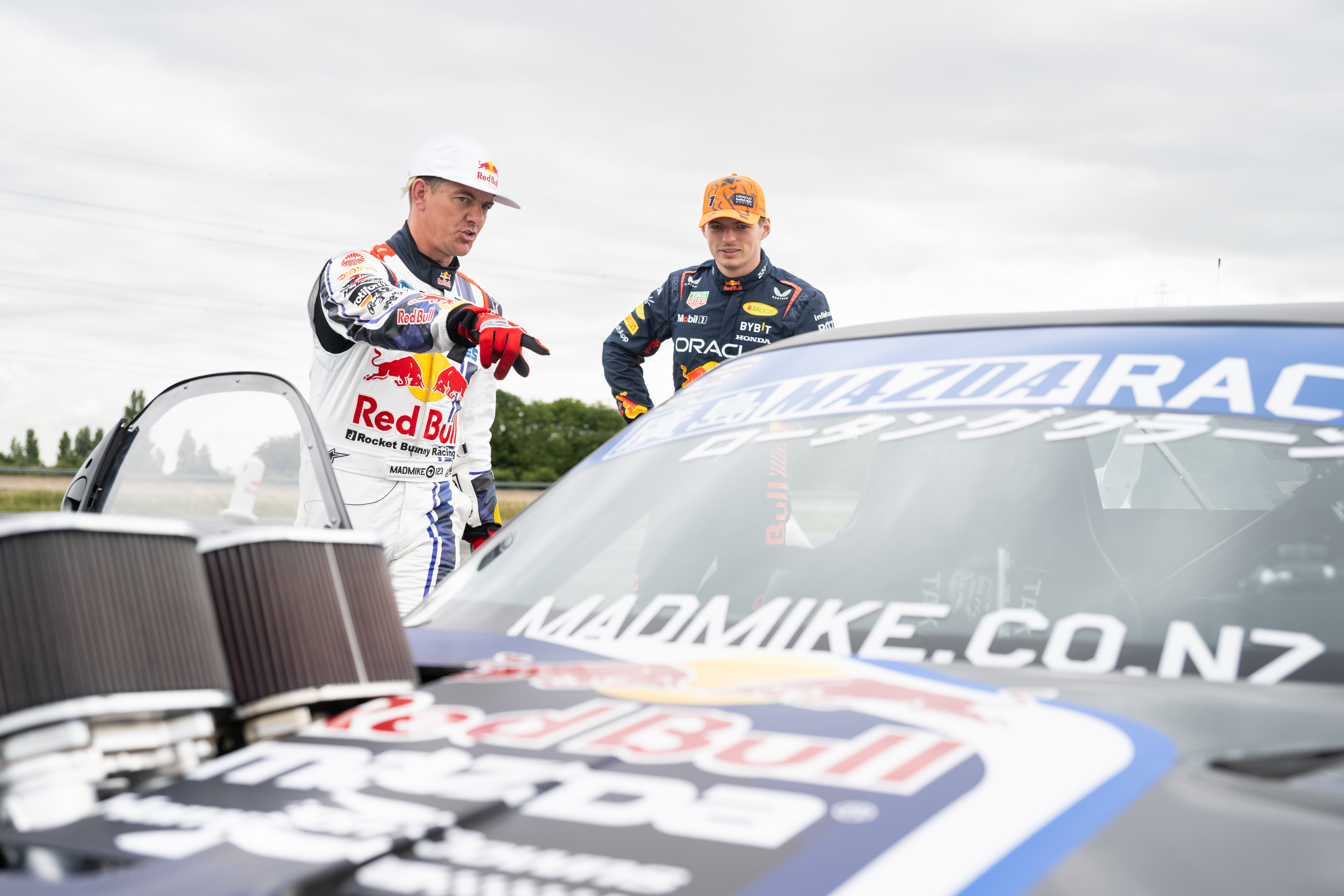Mike Whiddett and Max Verstappen stood by a drift car