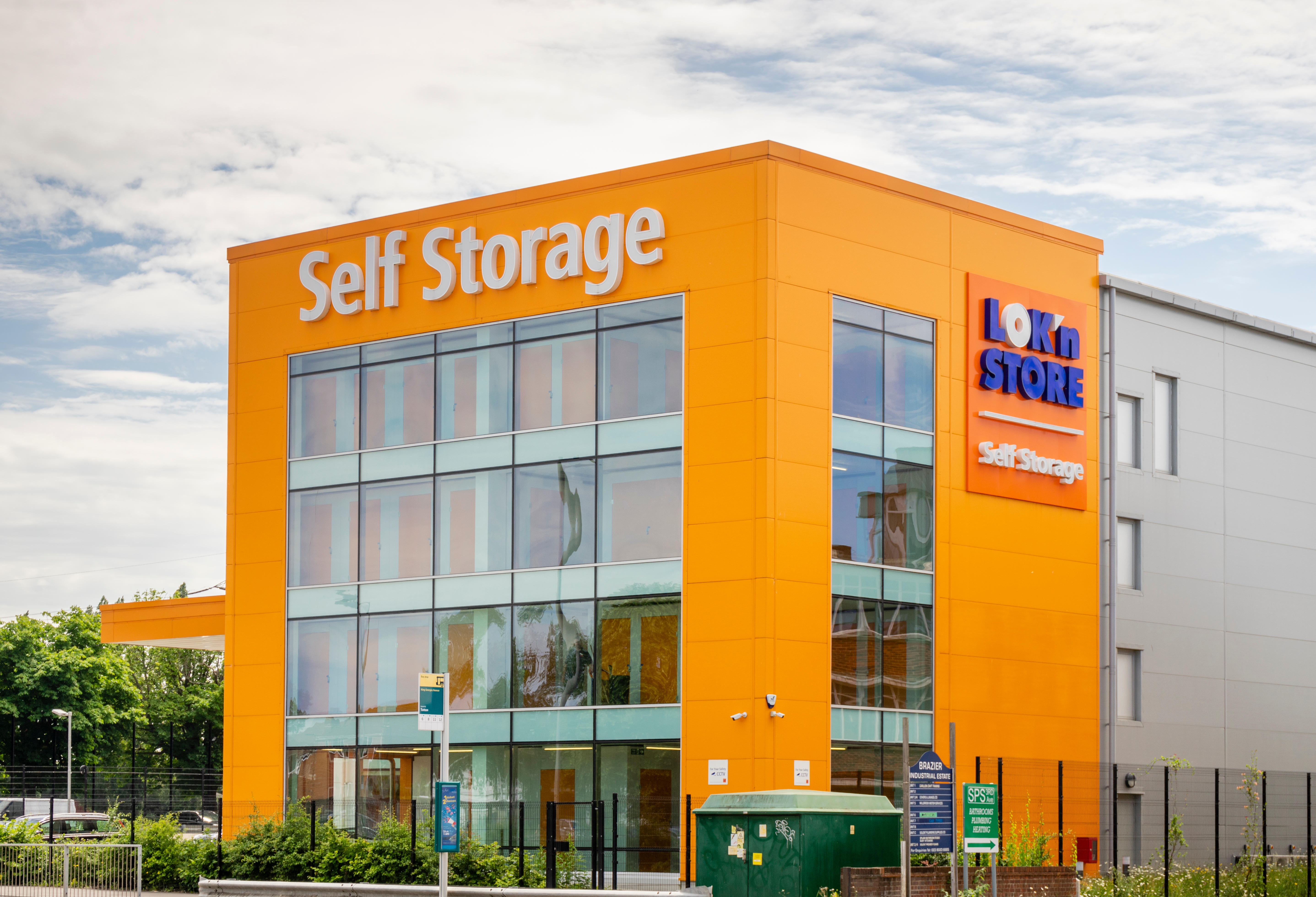 Orange coloured building facade of a Lok'nStore self age unit in Southampton, England, UK