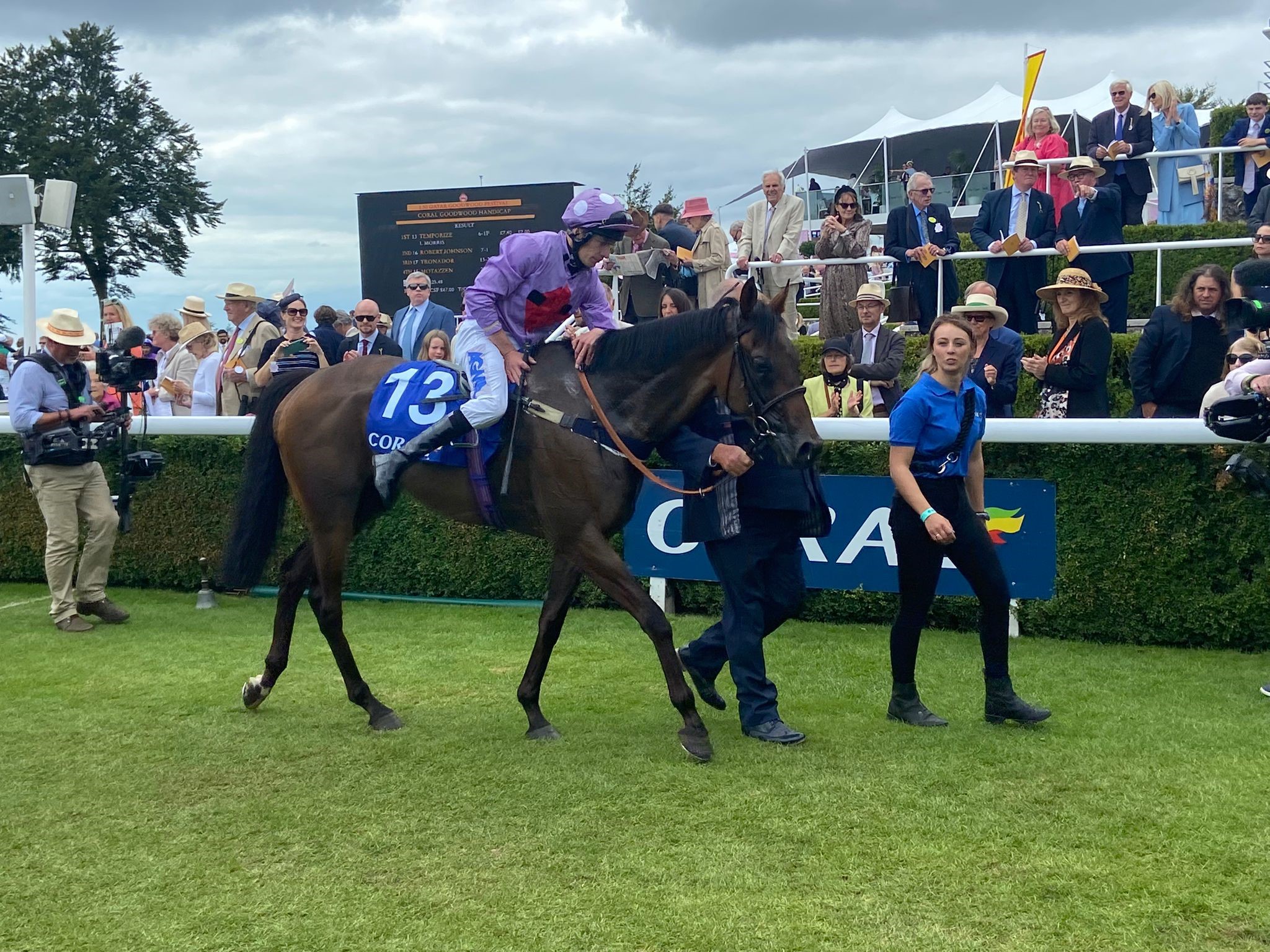 Luke Morris gives Temporize a pat after victory at Goodwood 
