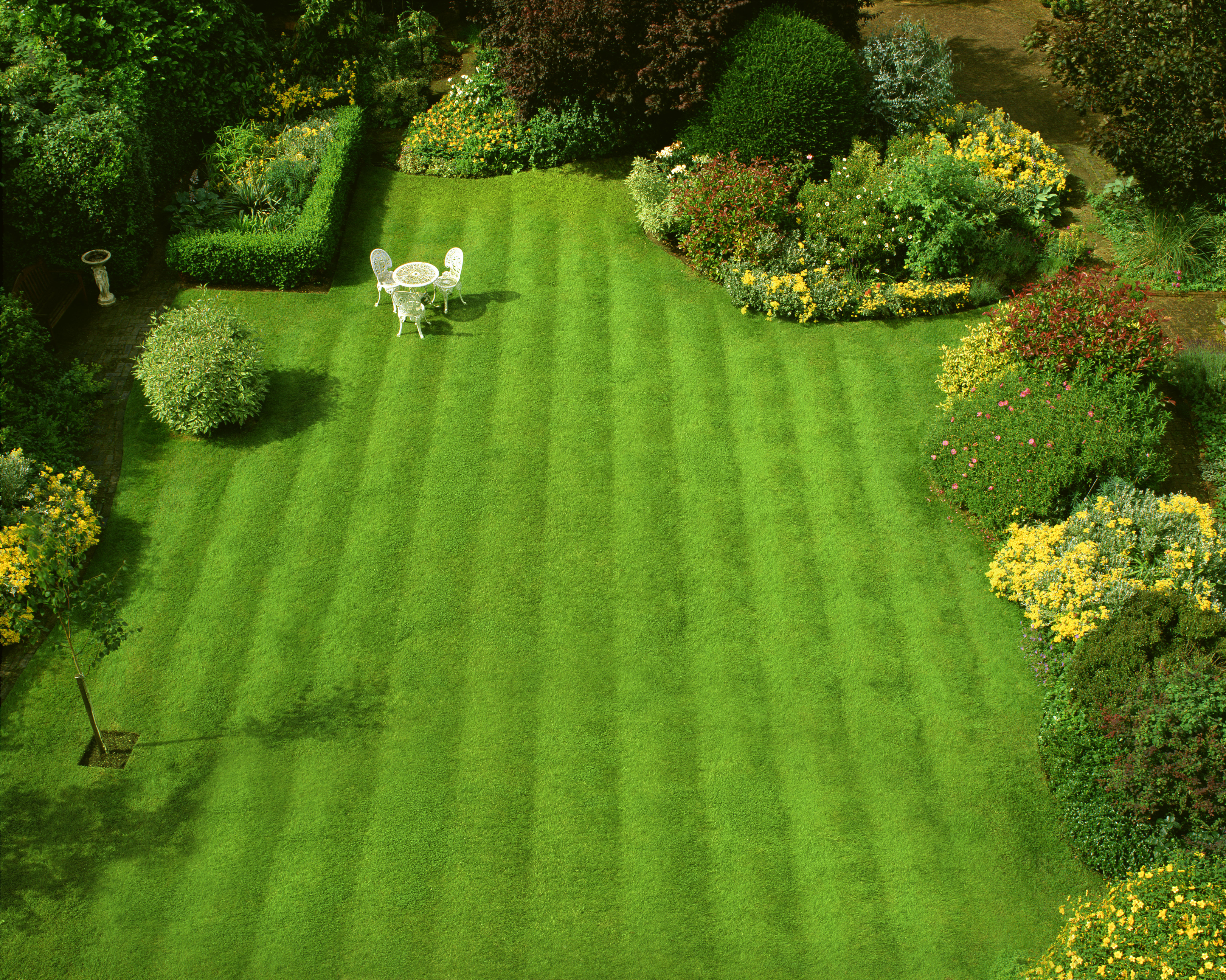 A carefully manicured, striped lawn (Alamy/PA)