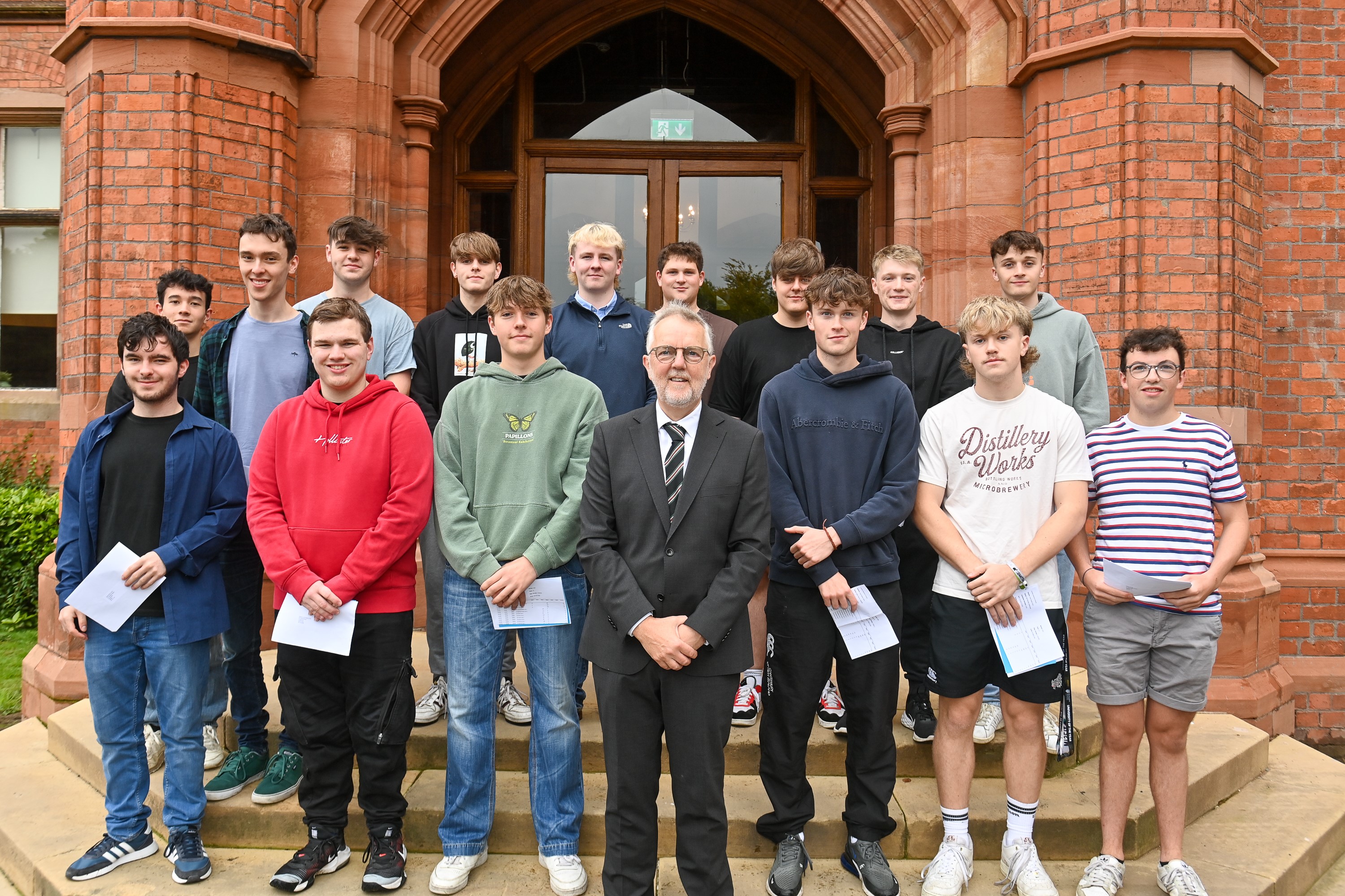 Headmaster of Campbell College Robert Robinson with students from the school on A-Level results day. (PressEye)