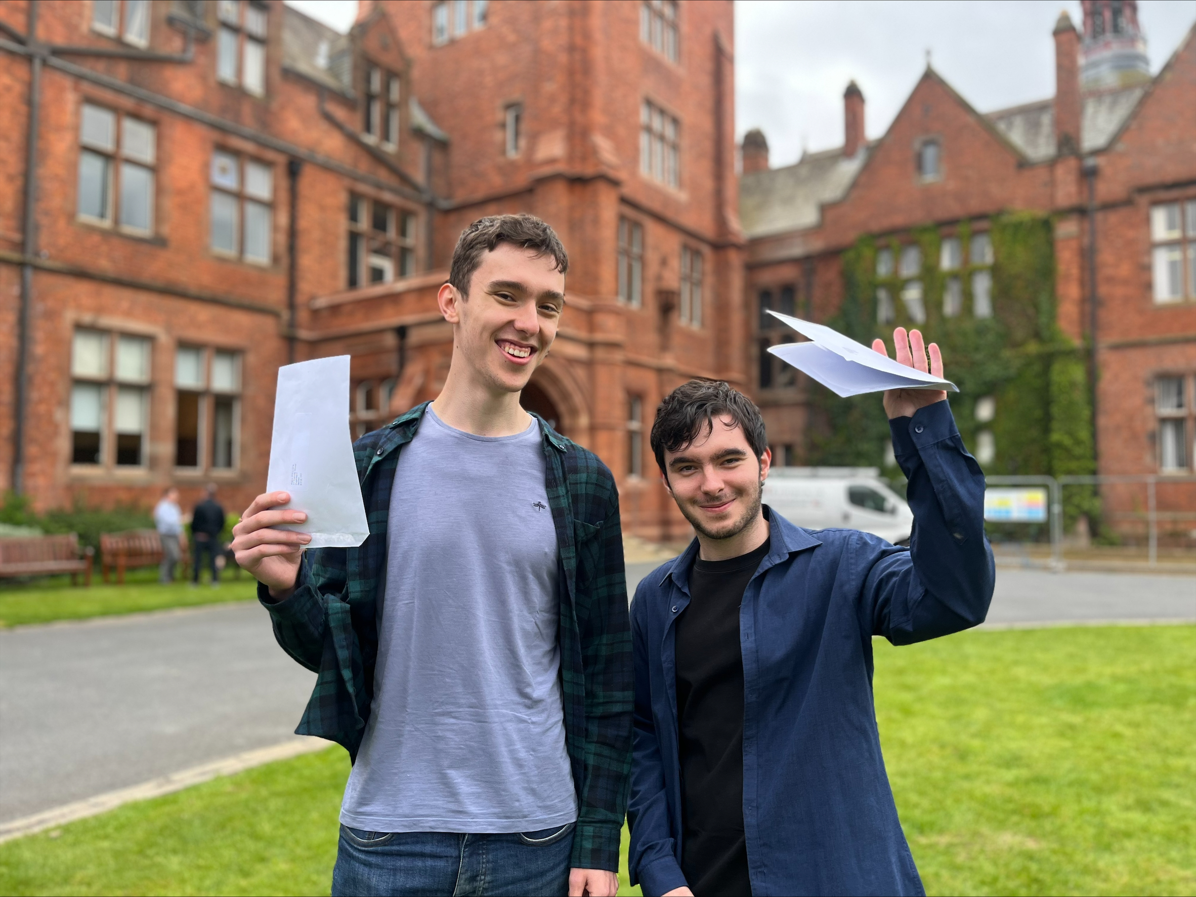 Twin brother Angus and Aaron Pollock from Campbell College, Belfast on A-Level results day. (Claudia Savage/PA)