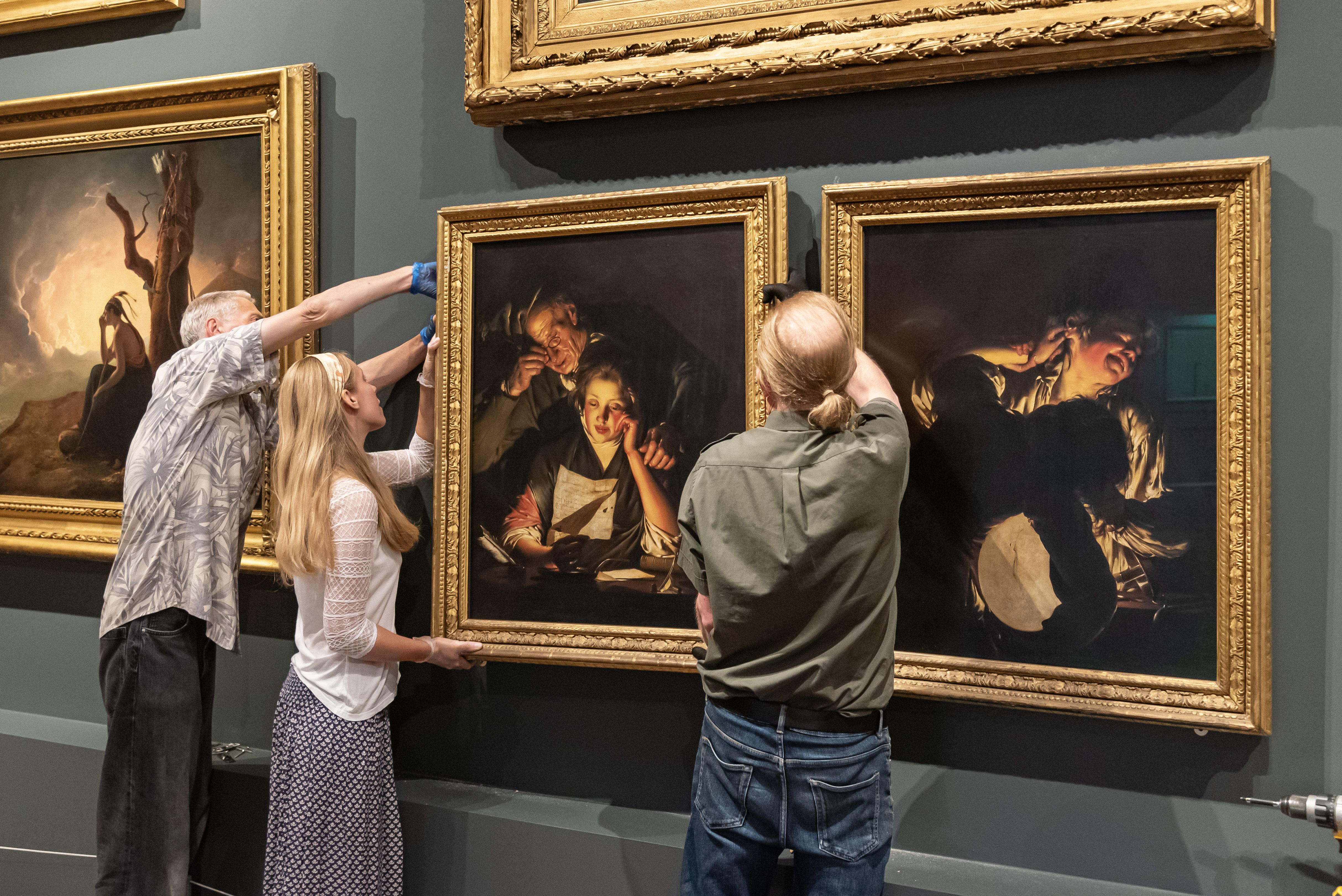 The paintings were carefully installed on Monday (Oliver Taylor/Derby Museums/PA)