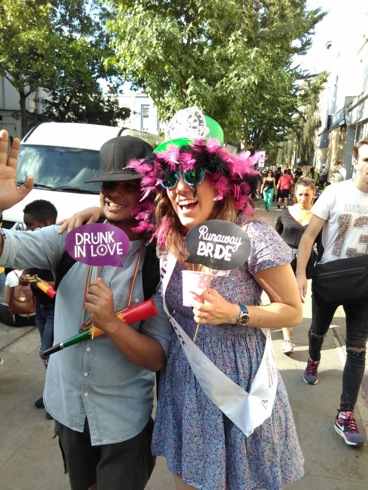 People posing together, wearing sunglasses and hats