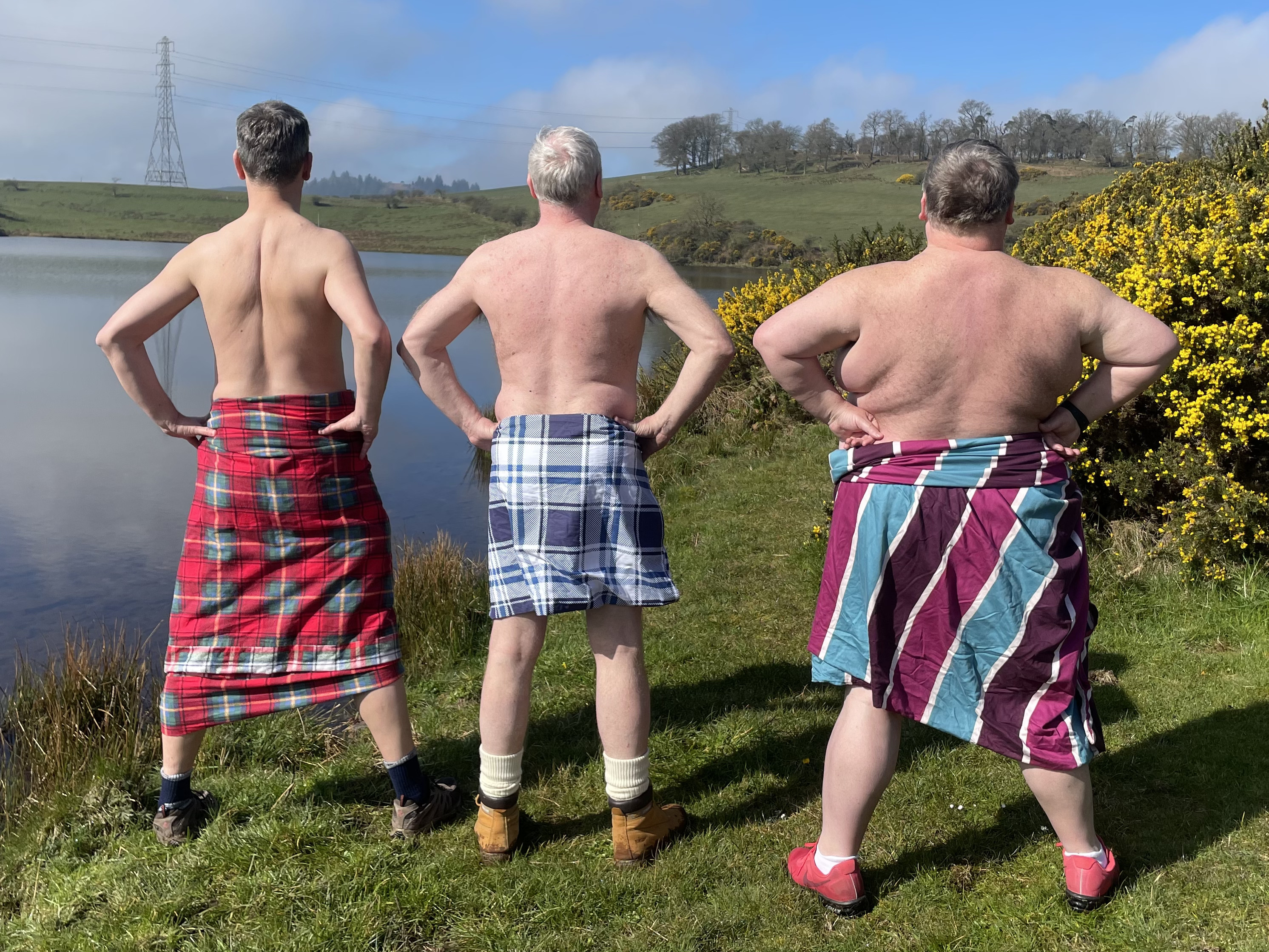 The backs of the 'Men in Quilts' Ronnie Black (right), Kenny Sinclair (middle) and Graham Stewart (left)