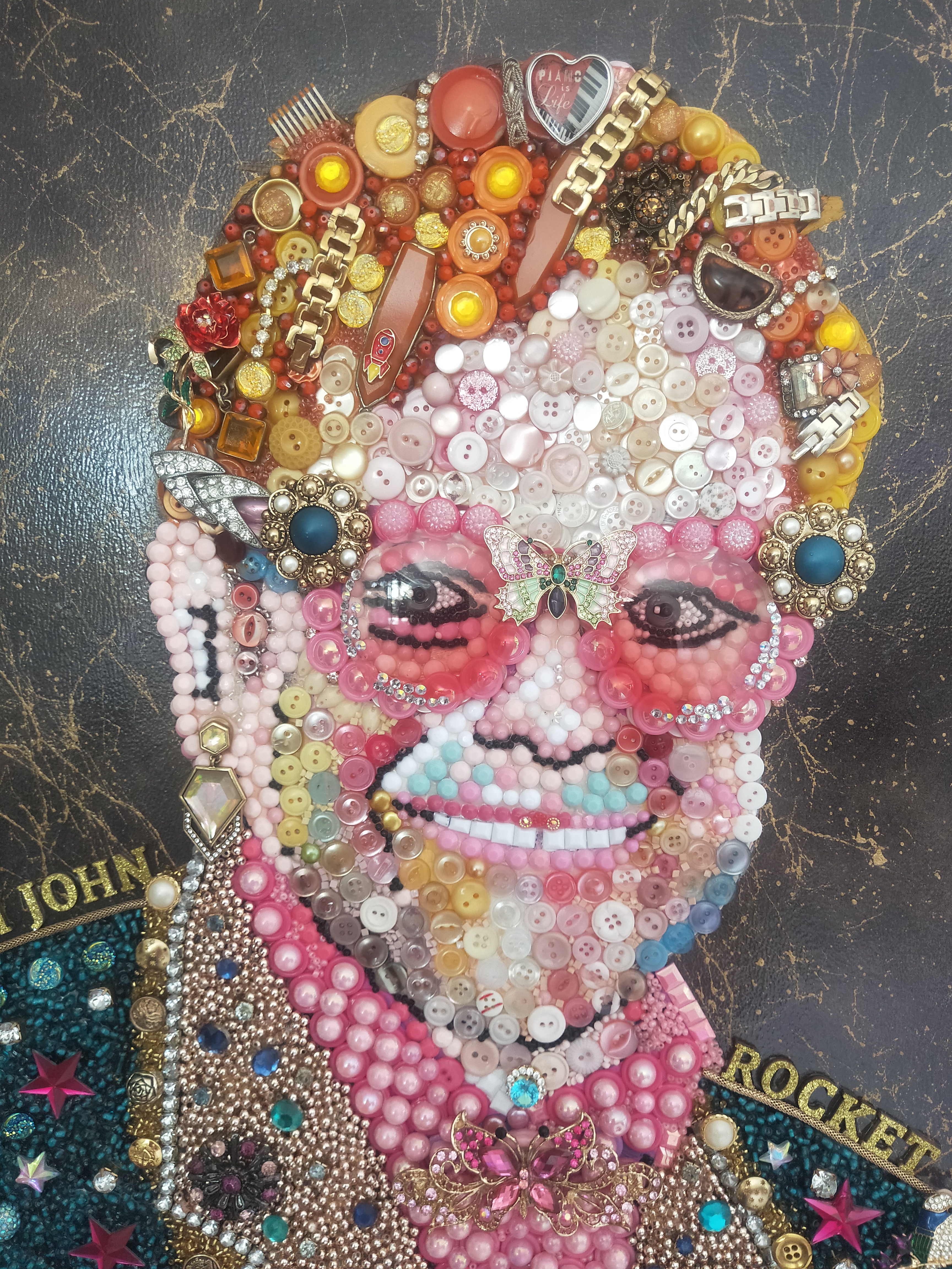 A closeup image of the Sir Elton John piece