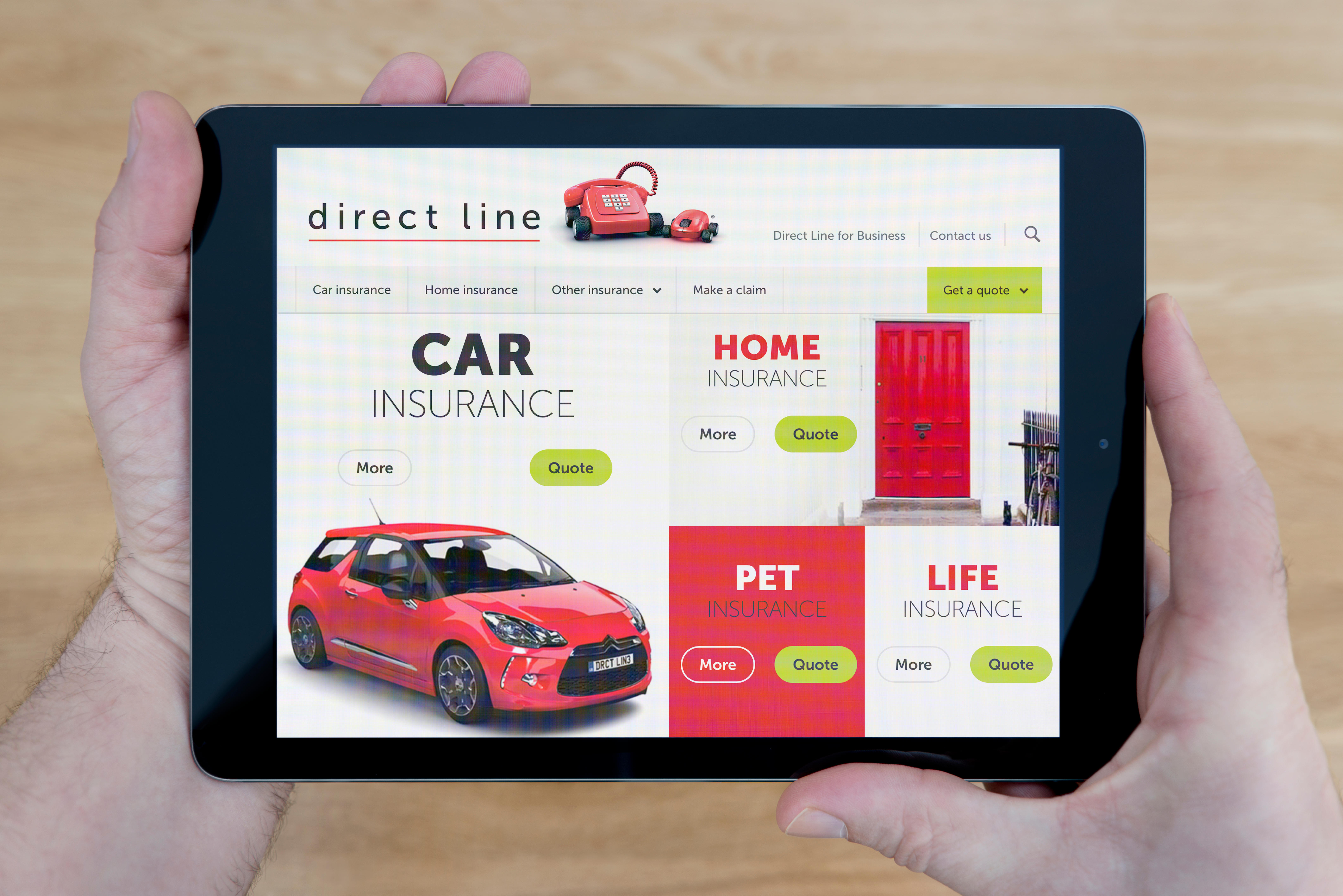 A man looks at the Direct Line website on his iPad