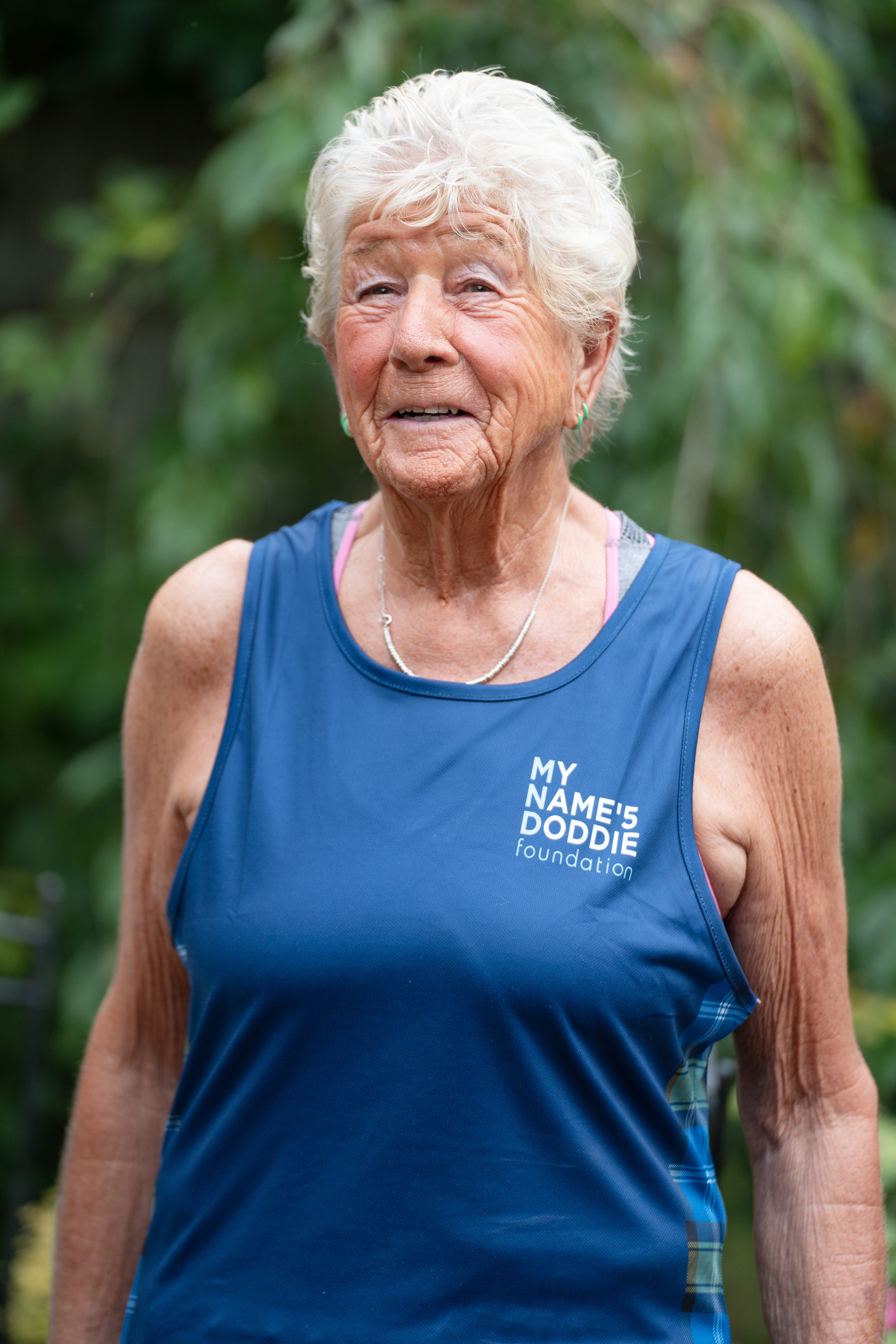 A close-up shot of Caroline Quibell wearing a My Name'5 Doddie Foundation top