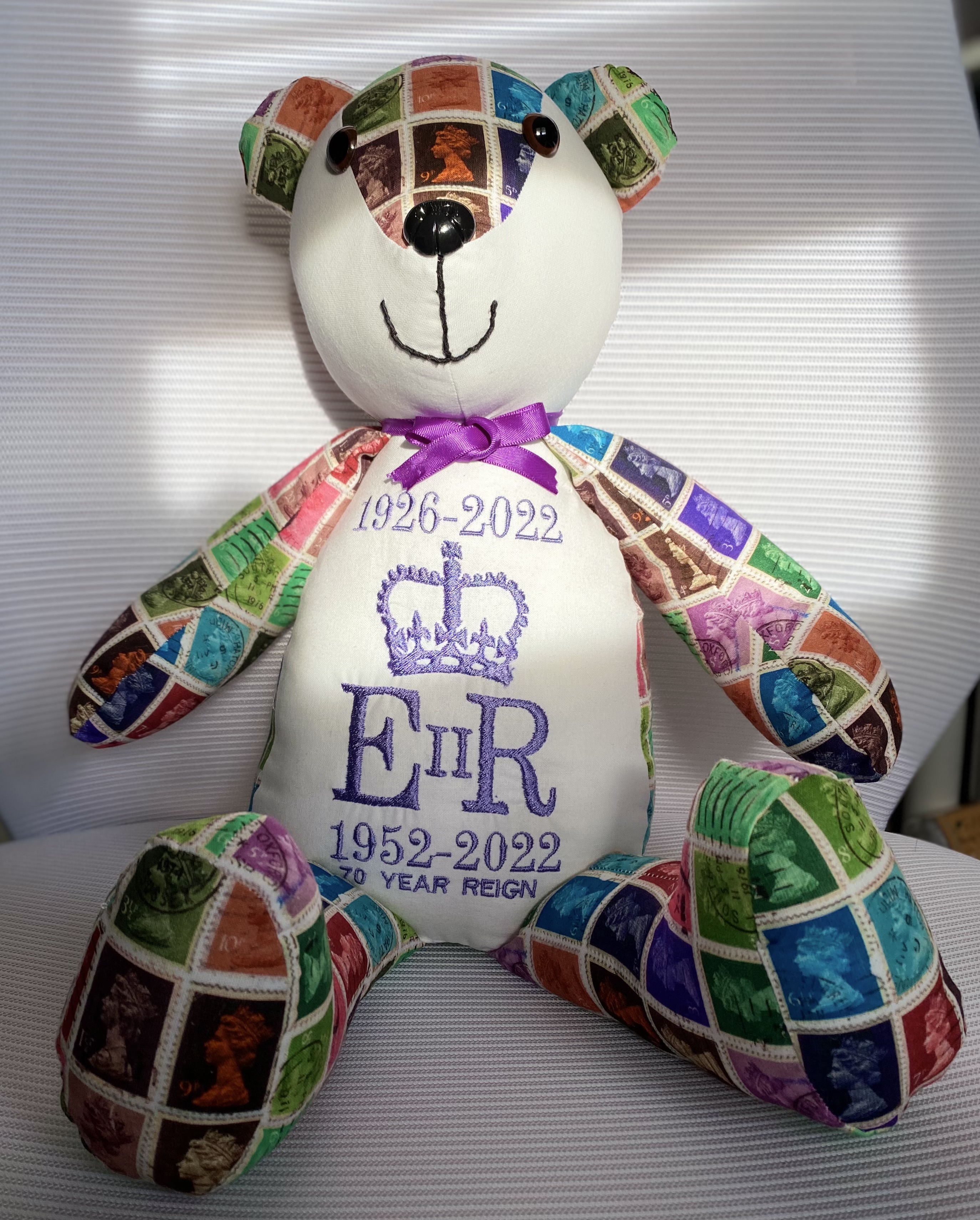 The memory bear depicting the Queen's cipher and details of her reign on the bear's front 