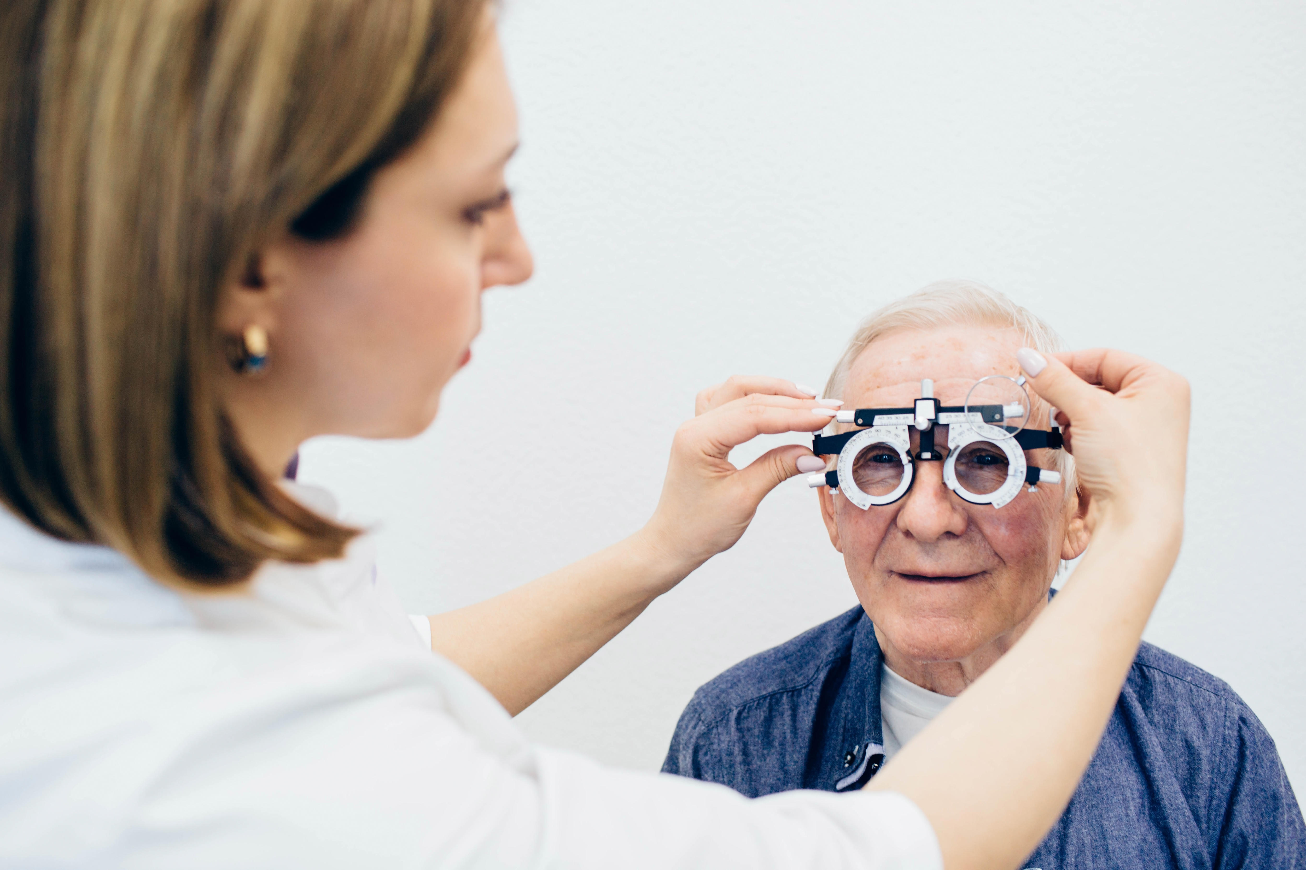A mature man having an eye test