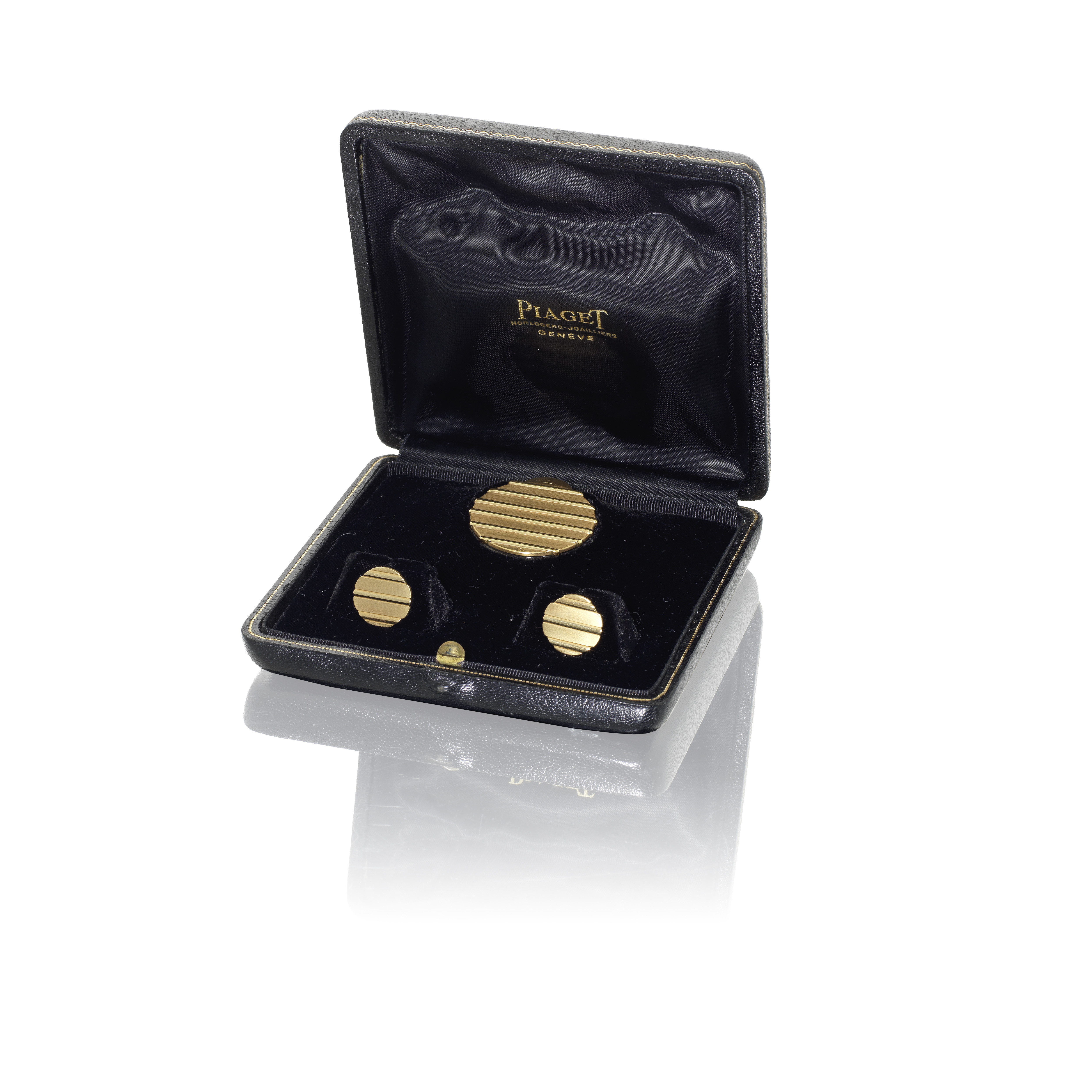 A pair of gold Piaget cufflinks owned by Roger Moore