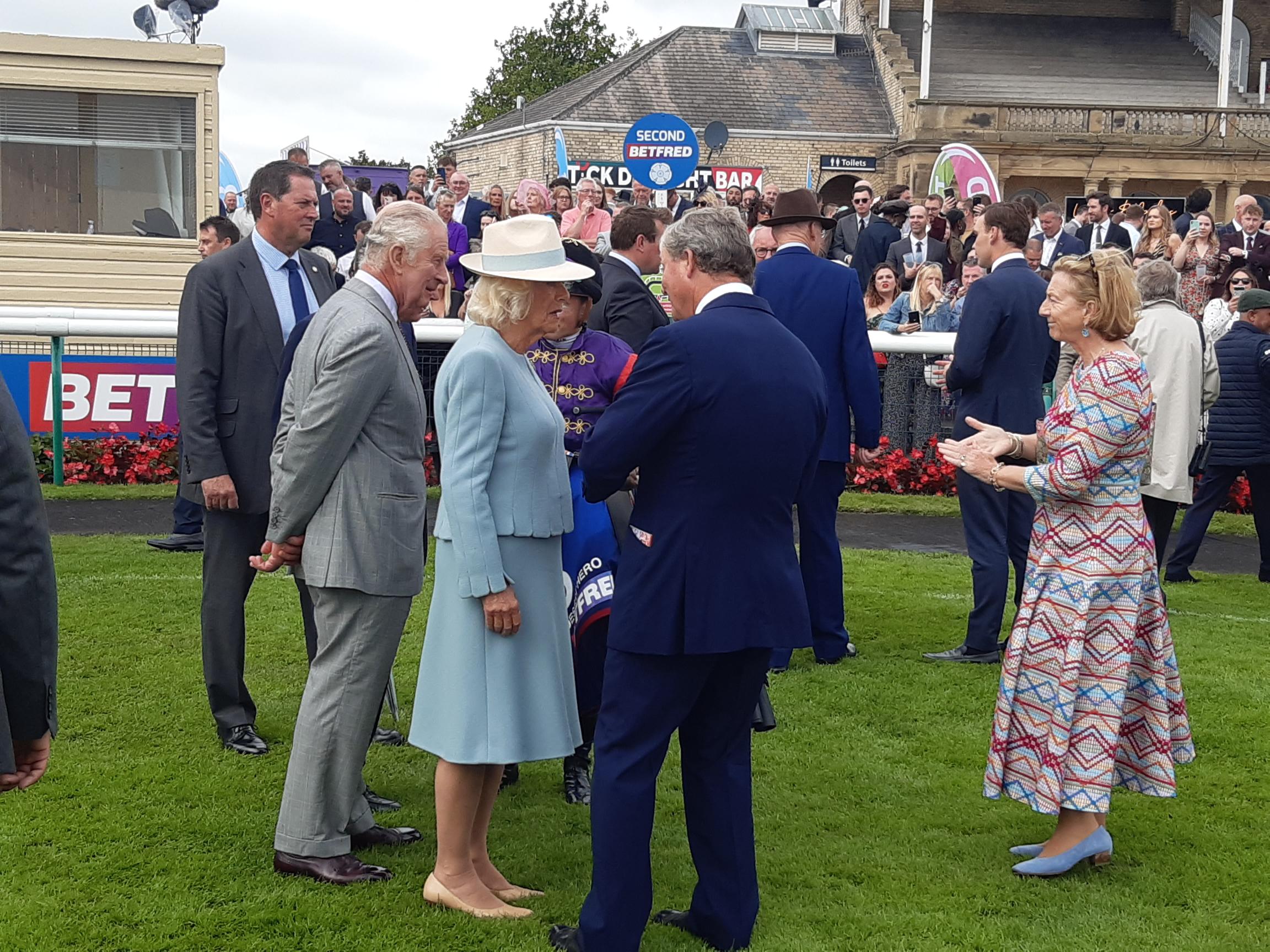 William Haggas explains to the King and Queen where the race was won and lost