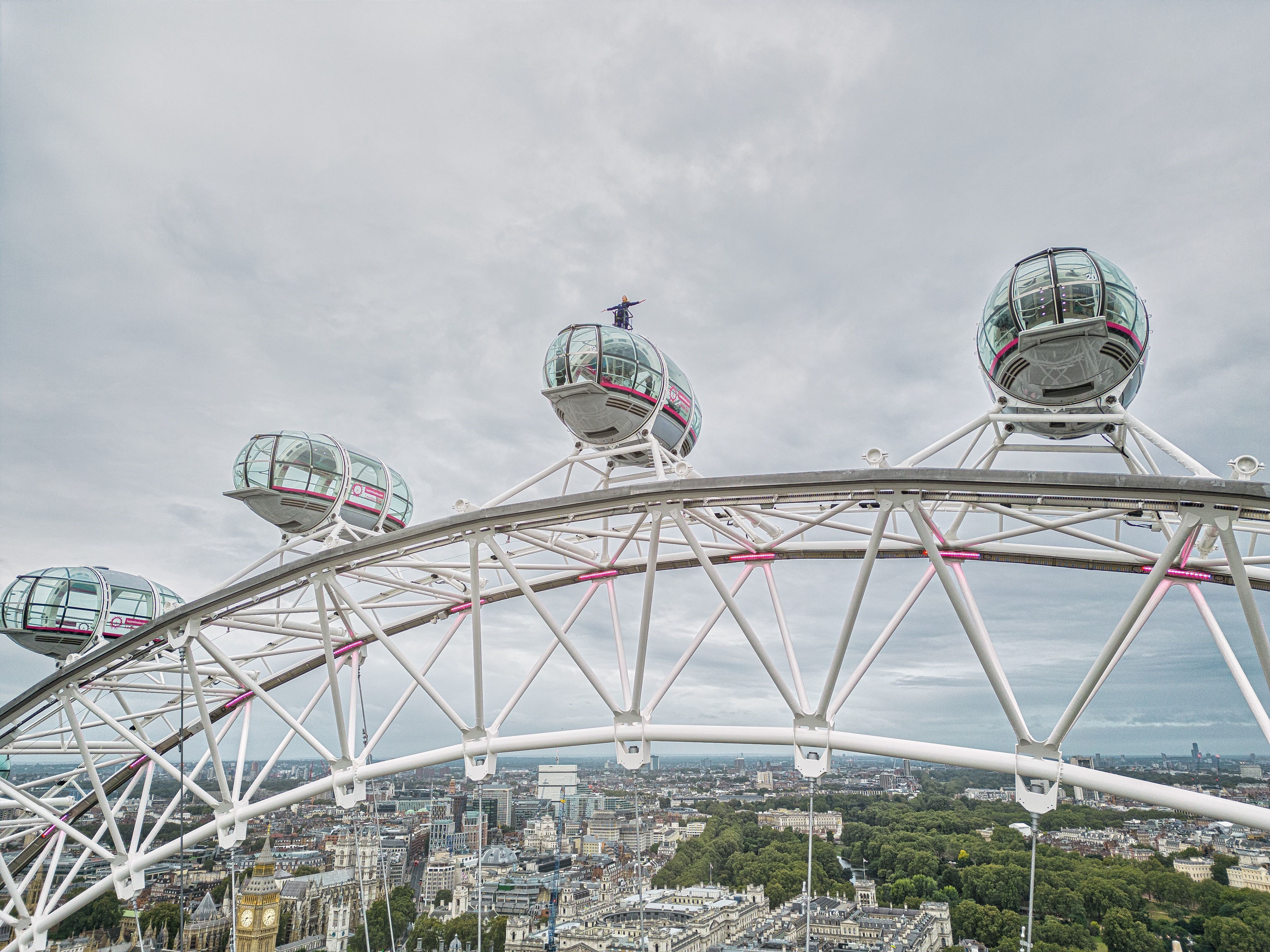 Sally Williams harnessed 135m (443ft) high on top of the London Eye for 20 minutes at 7 am presenting the weather forecast