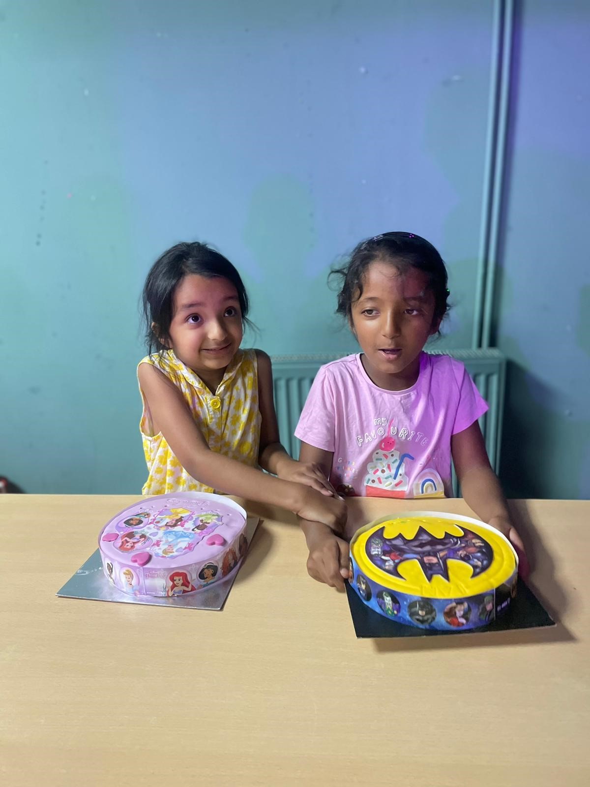 Daya and twin sister Jasmine with Disney princess and Batman cakes as they celebrated their 7th birthdays on September 22