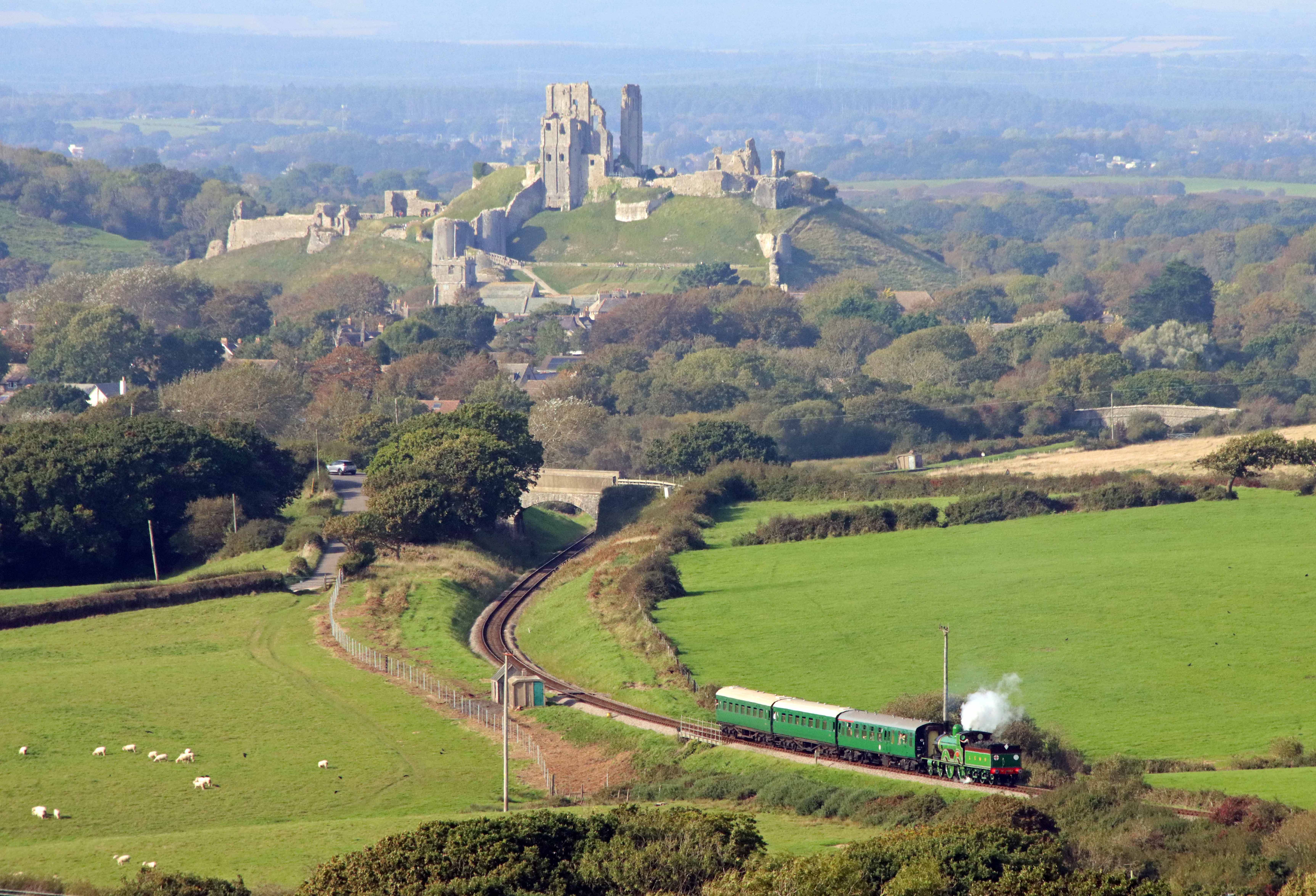 The locomotive running with Corfe Castle in the background