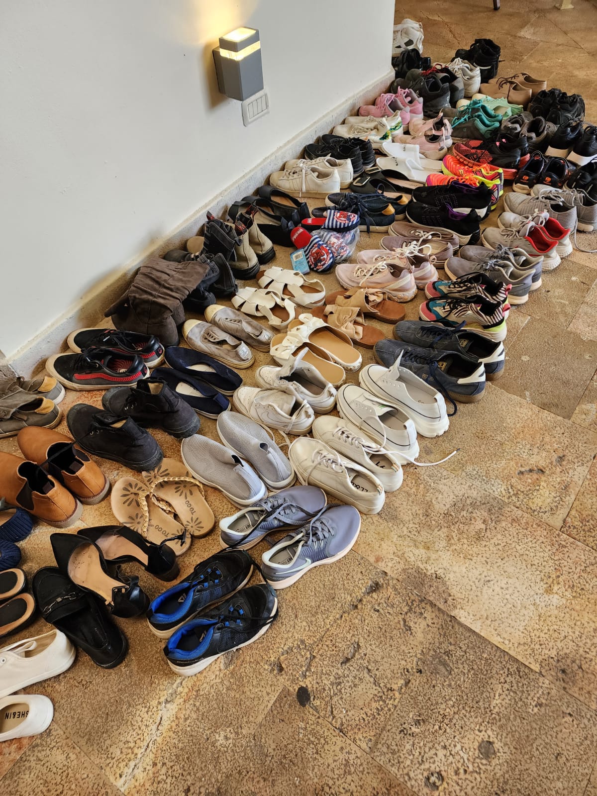 Pairs of donated shoes at the hotel Ben and his family are now sheltering in 