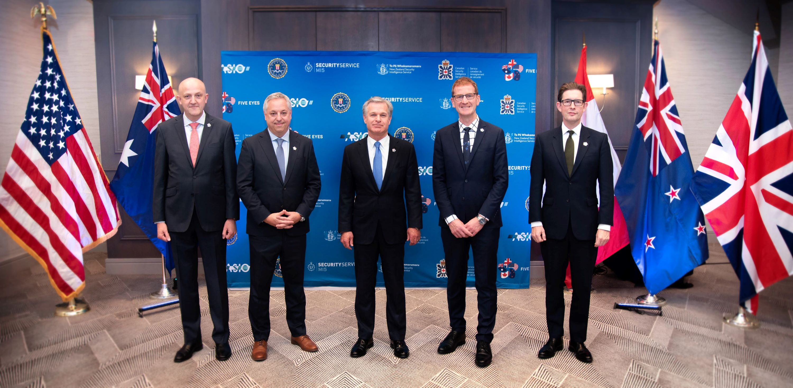 From left, Australian Security Intelligence Organisation director-general Mike Burgess; Canadian Security Intelligence Service director David Vigneault; FBI director Christopher Wray; New Zealand Security Intelligence Service director-general of security and chief executive Andrew Hampton; and MI5 director-general Ken McCallum pose for a group photo during the Emerging Technology and Securing Innovation Summit in Palo Alto 