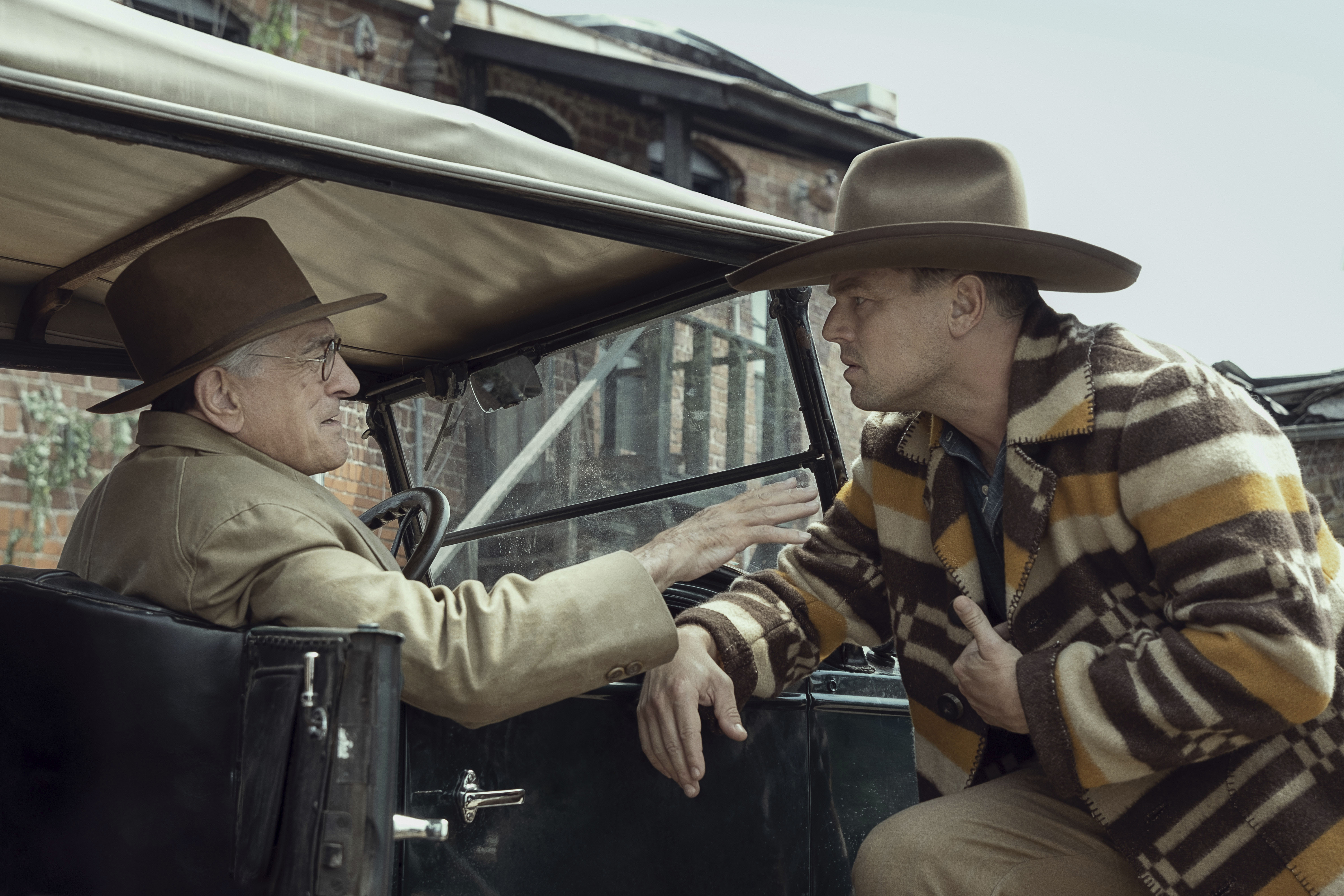 This image released by Apple TV+ shows Robert De Niro, left, and Leonardo DiCaprio in a scene from Killers Of The Flower Moon 