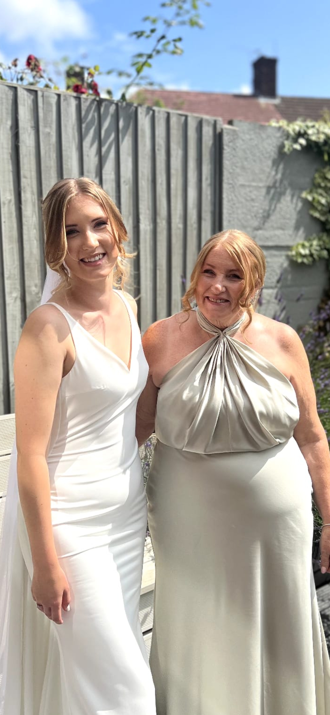 Daughter and mother in wedding attire