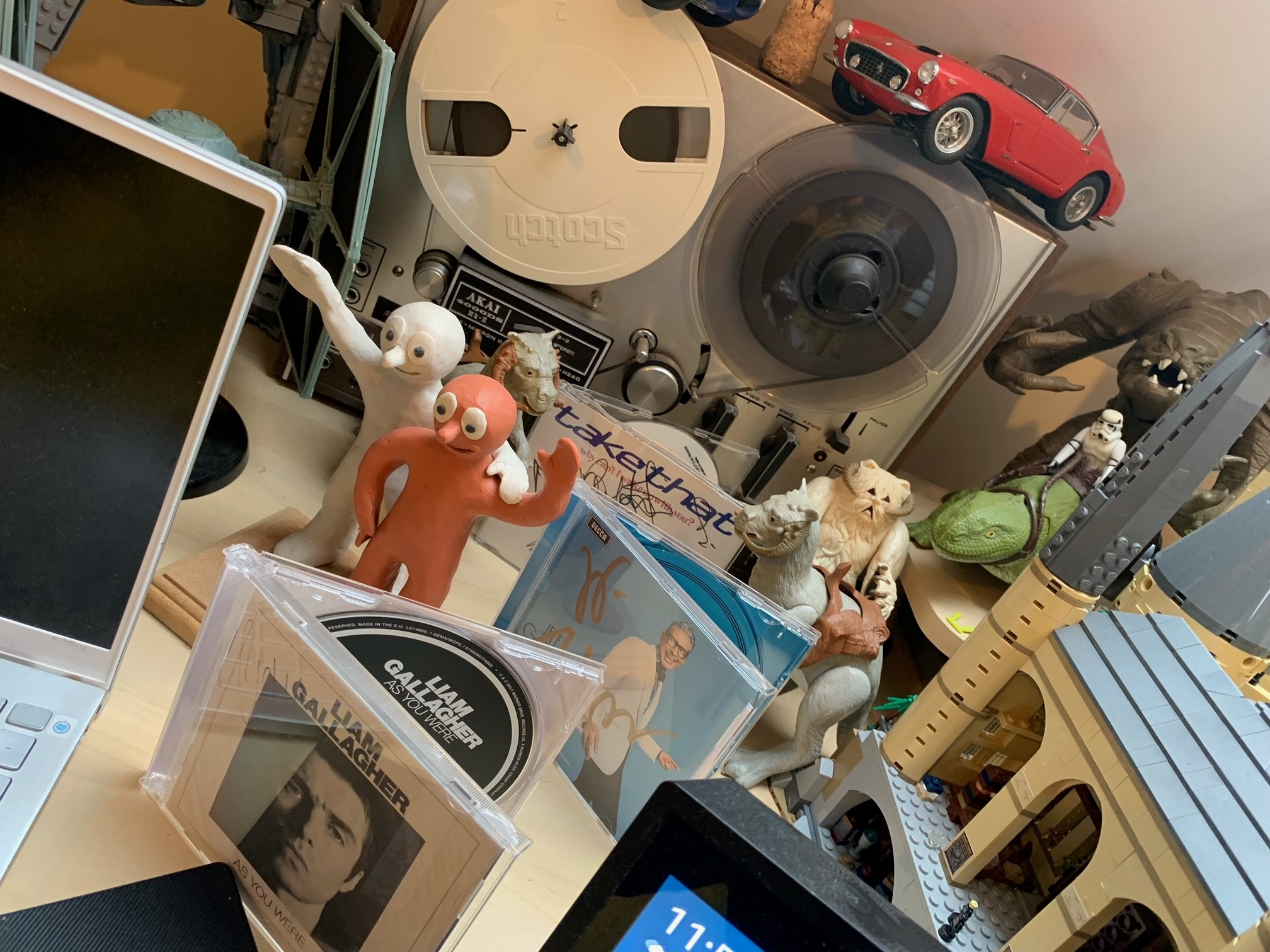 Nick Gibbs-McNeil's collectibles, including a signed Take That CD