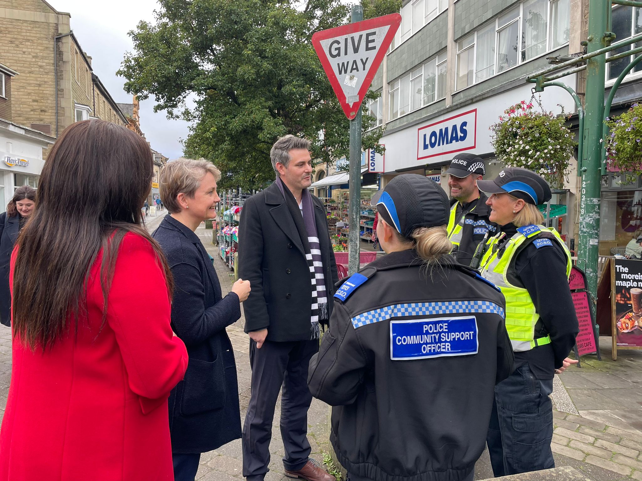 Ms Cooper (second left) with the party's parliamentary candidate for High Peak, Jon Pearce, and the party Derbyshire Police and Crime Commissioner candidate, Nicolle Ndiweni, speaking to PCSOs in Buxton (Callum Parke/PA)