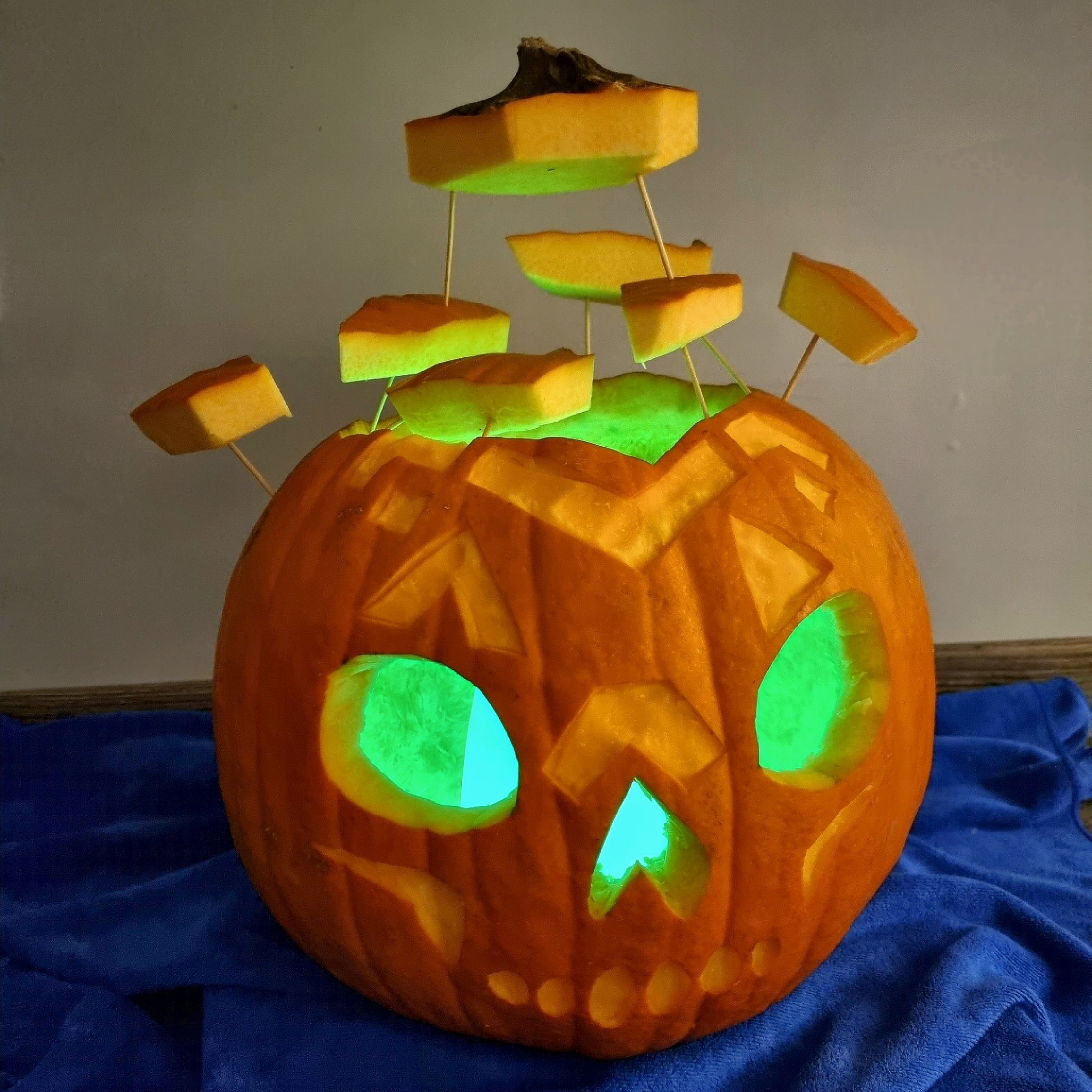 Pumpkin with pieces sticking out of head 