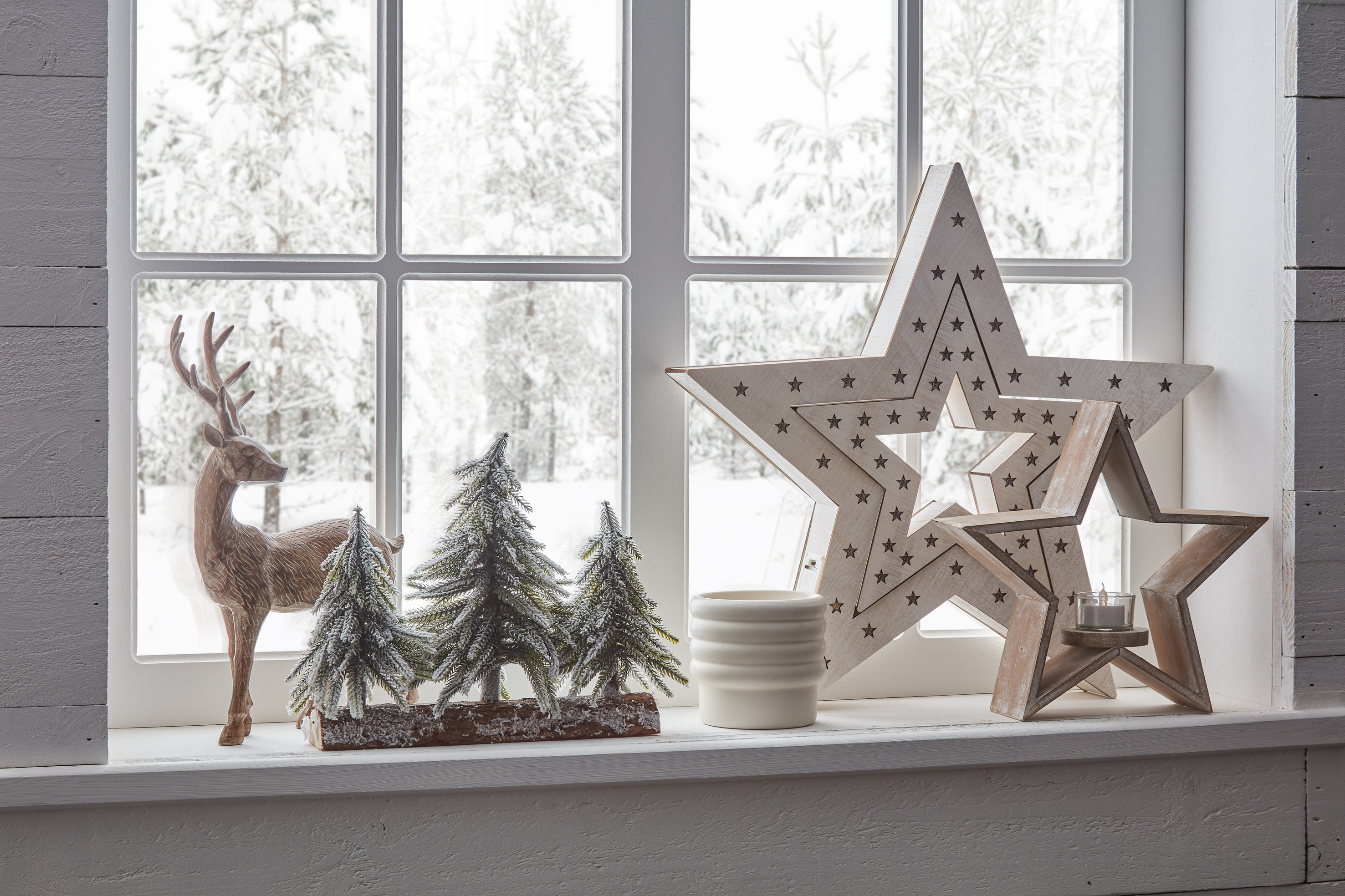 A windowsill with festive Christmas decorations