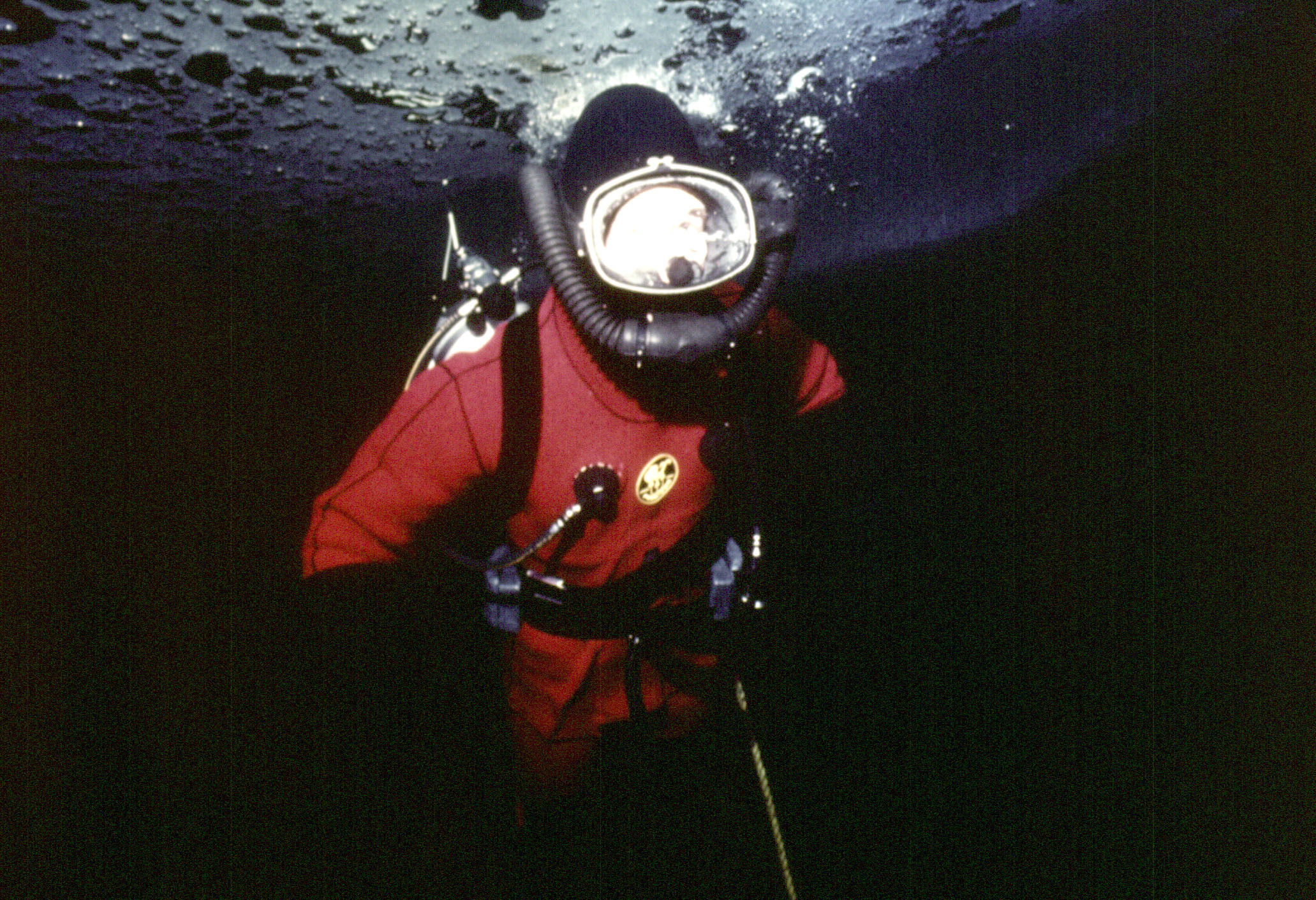 The Prince of Wales diving under the arctic ice at Resolute Bay, Canada