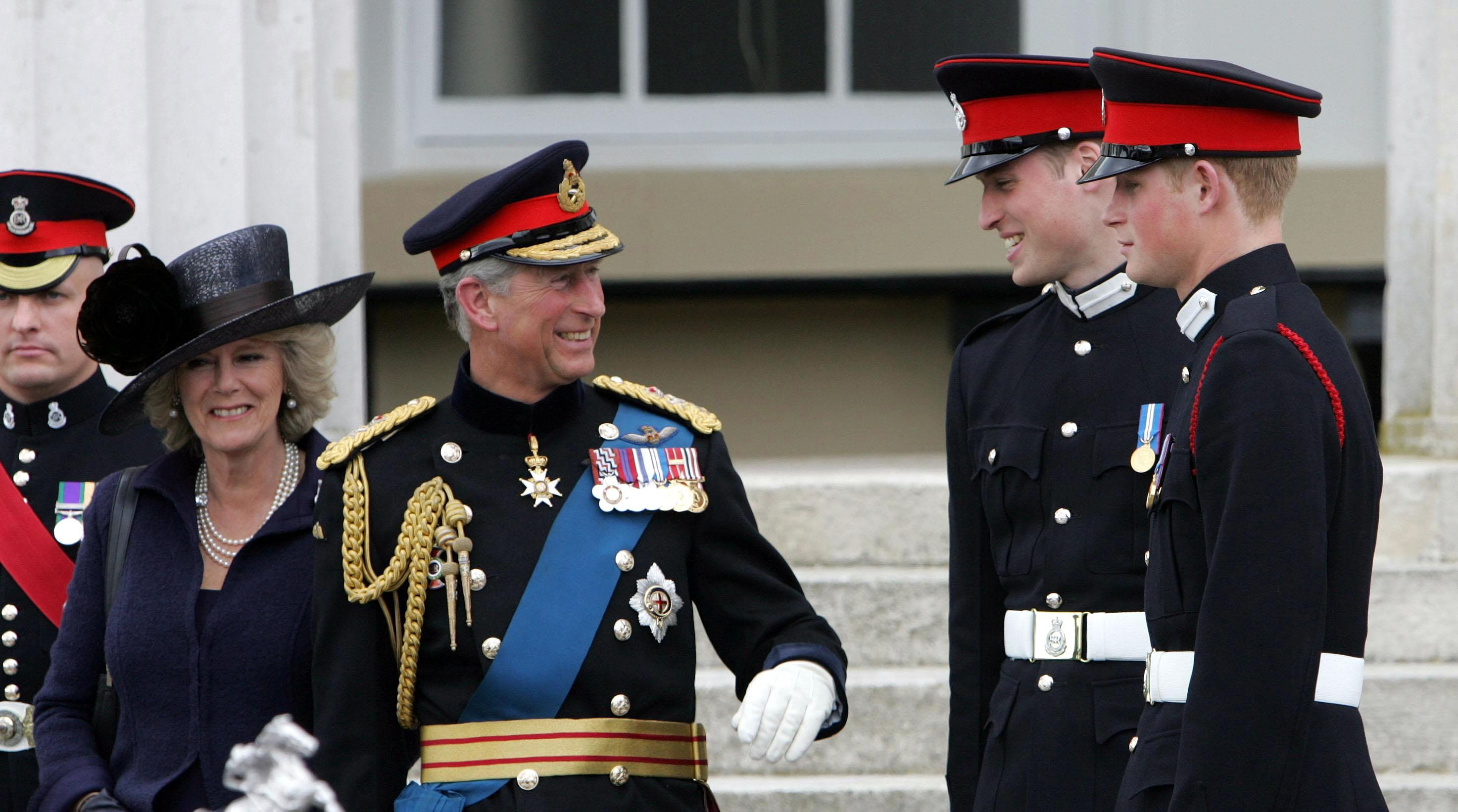 The Prince of Wales and the Duchess of Cornwall speaking to Prince William and Prince Harry before leaving Sandhurst Royal Military Academy after Harry's Sovereign's Parade
