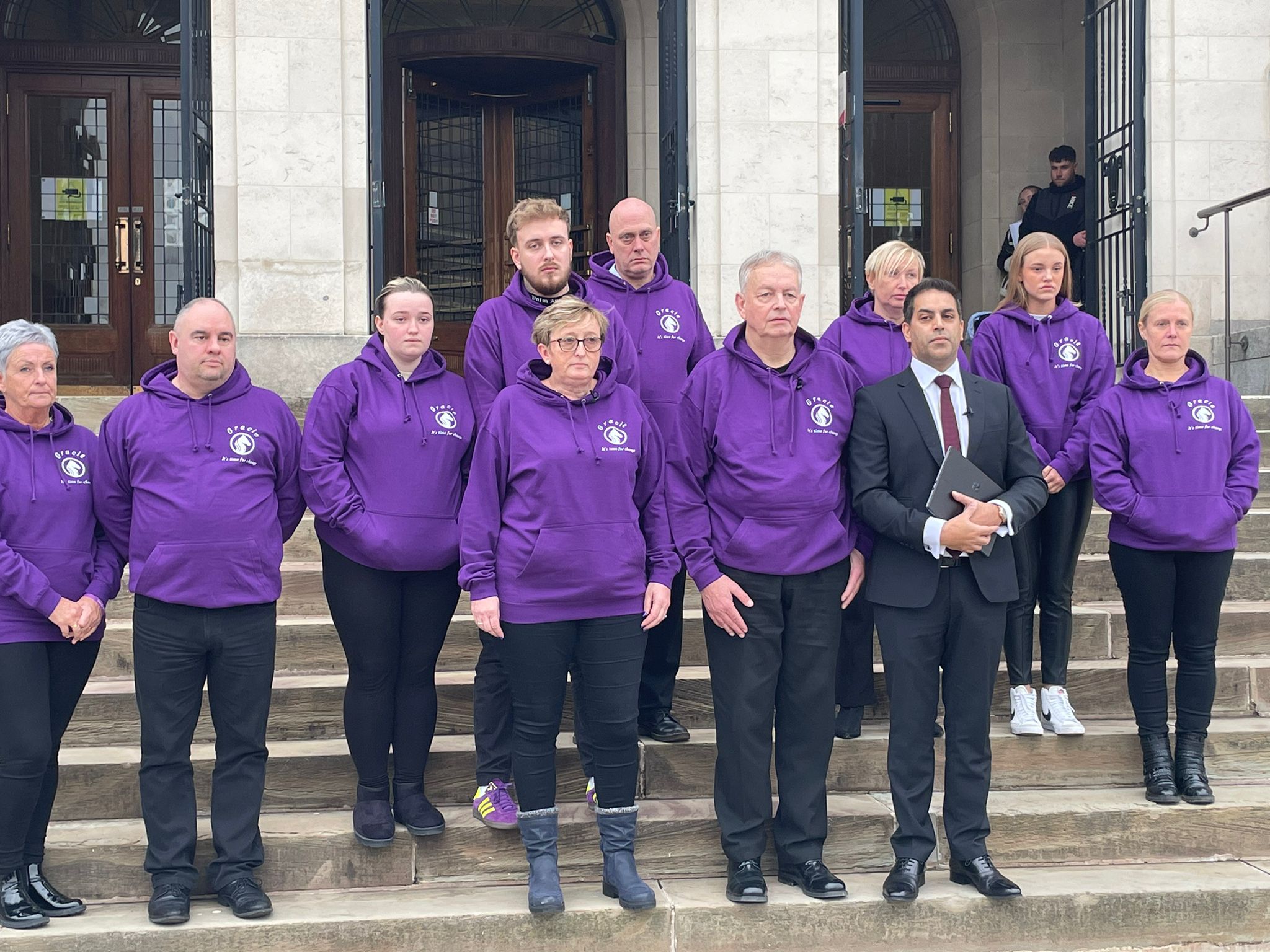 Ms Spinks' family outside court following the inquest, wearing purple jumpers, Ms Spinks' favourite colour (Callum Parke/PA)