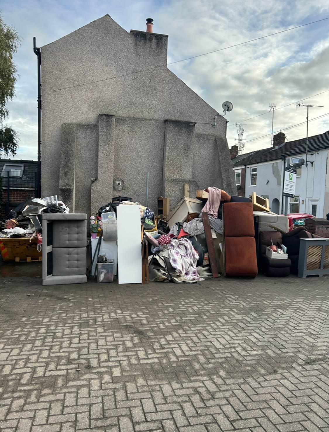 A pile of furniture outside a property in Chesterfield following heavy flooding 