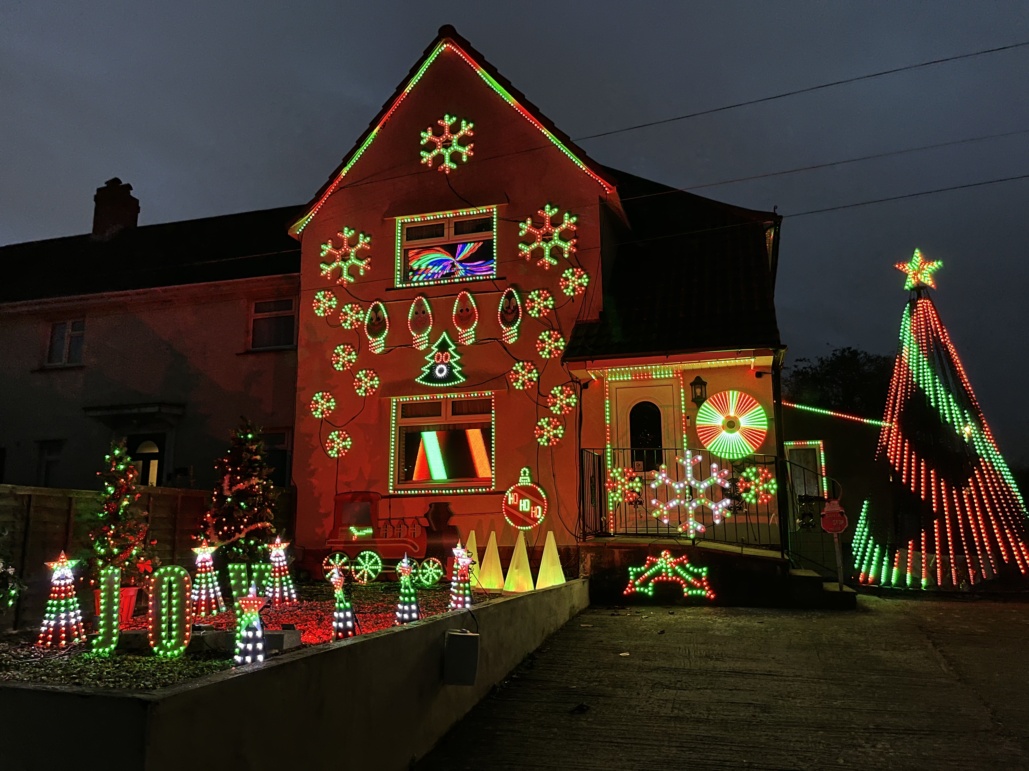 A view of Ian and Ann Cooper's house covered in lights 