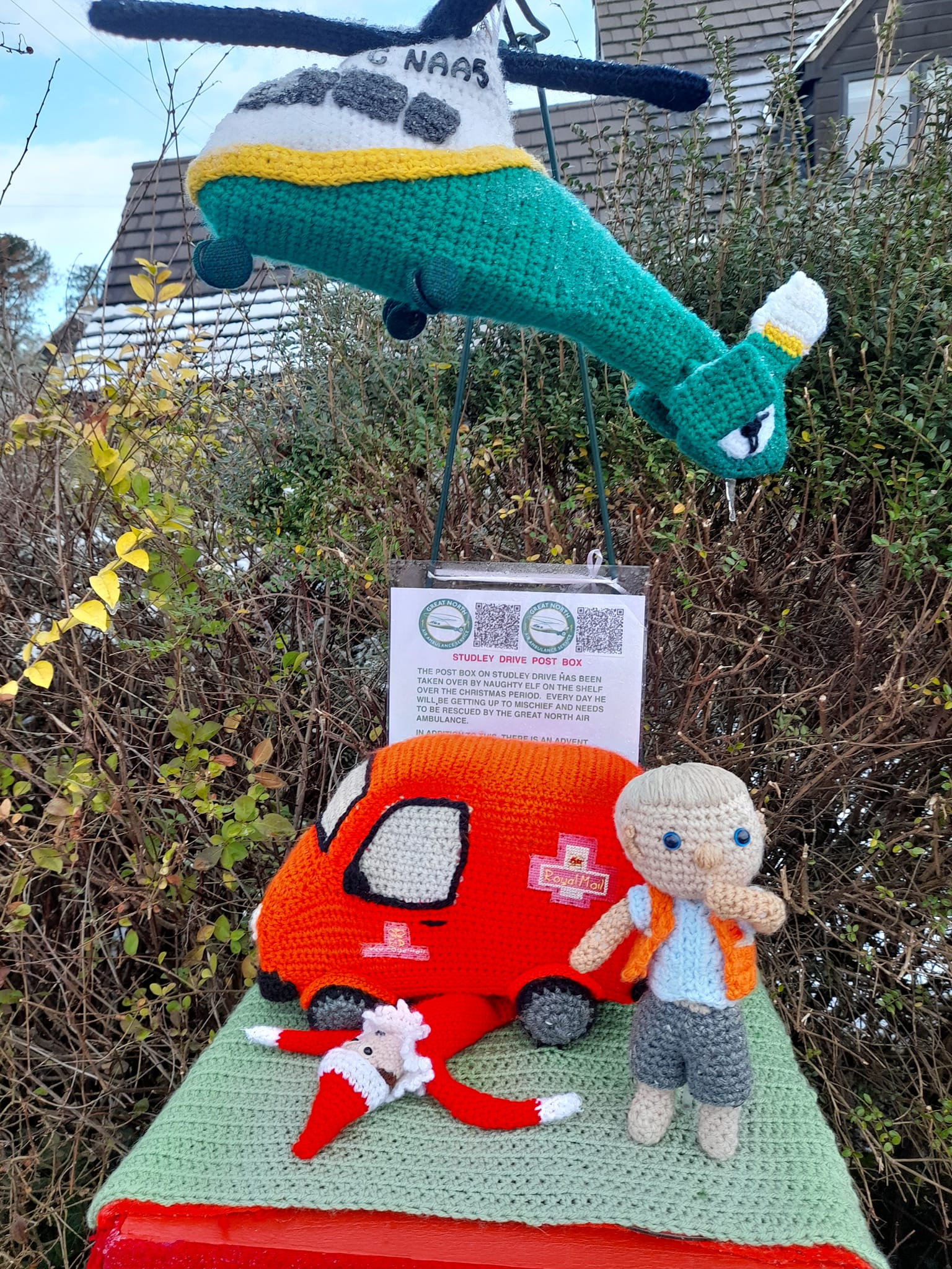 Crocheted postman and van 