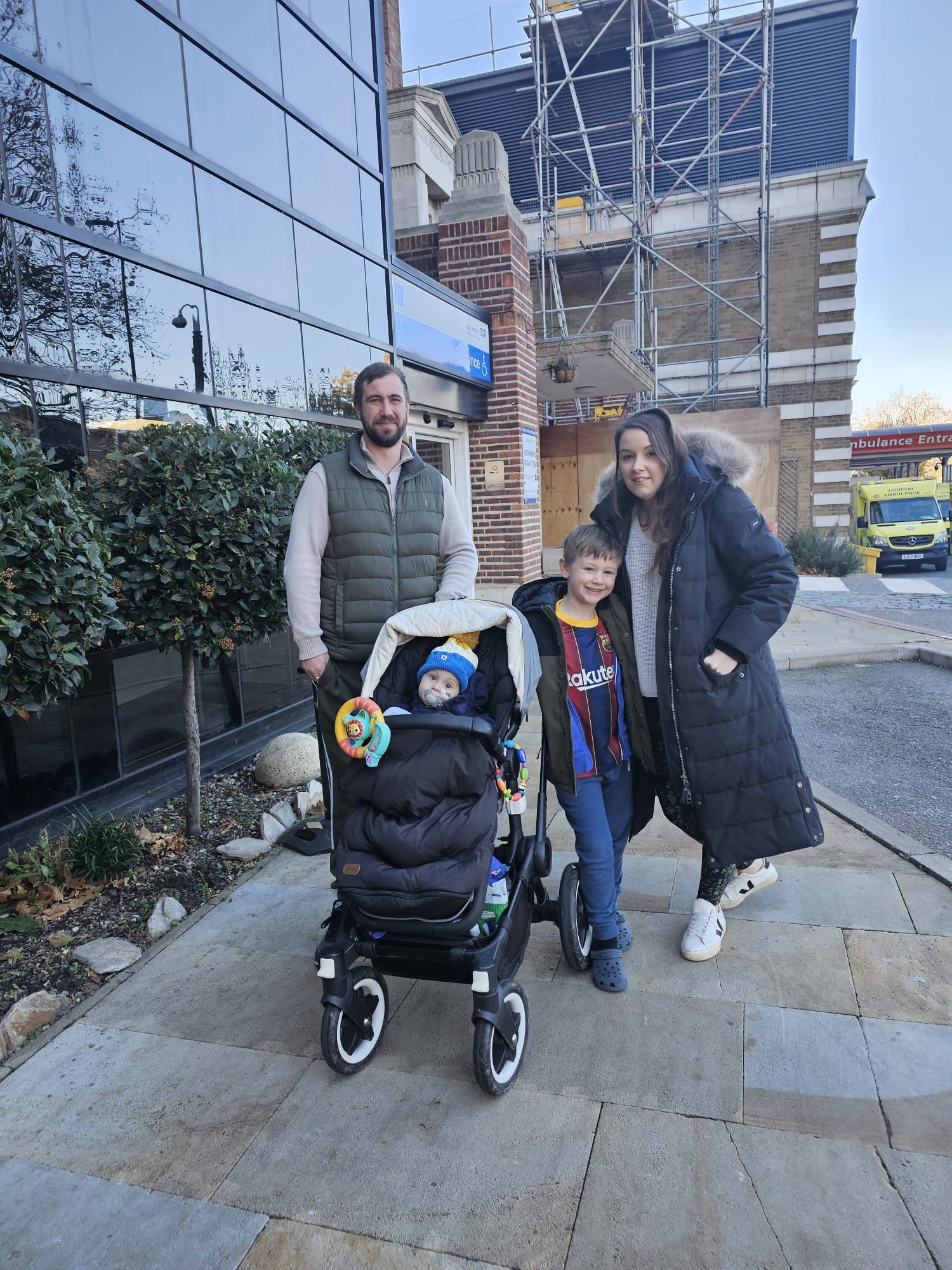 The Nicholls family outside King's College Hospital. Mum Emma (right) donated part of her liver to baby Teddy, 21 months.
