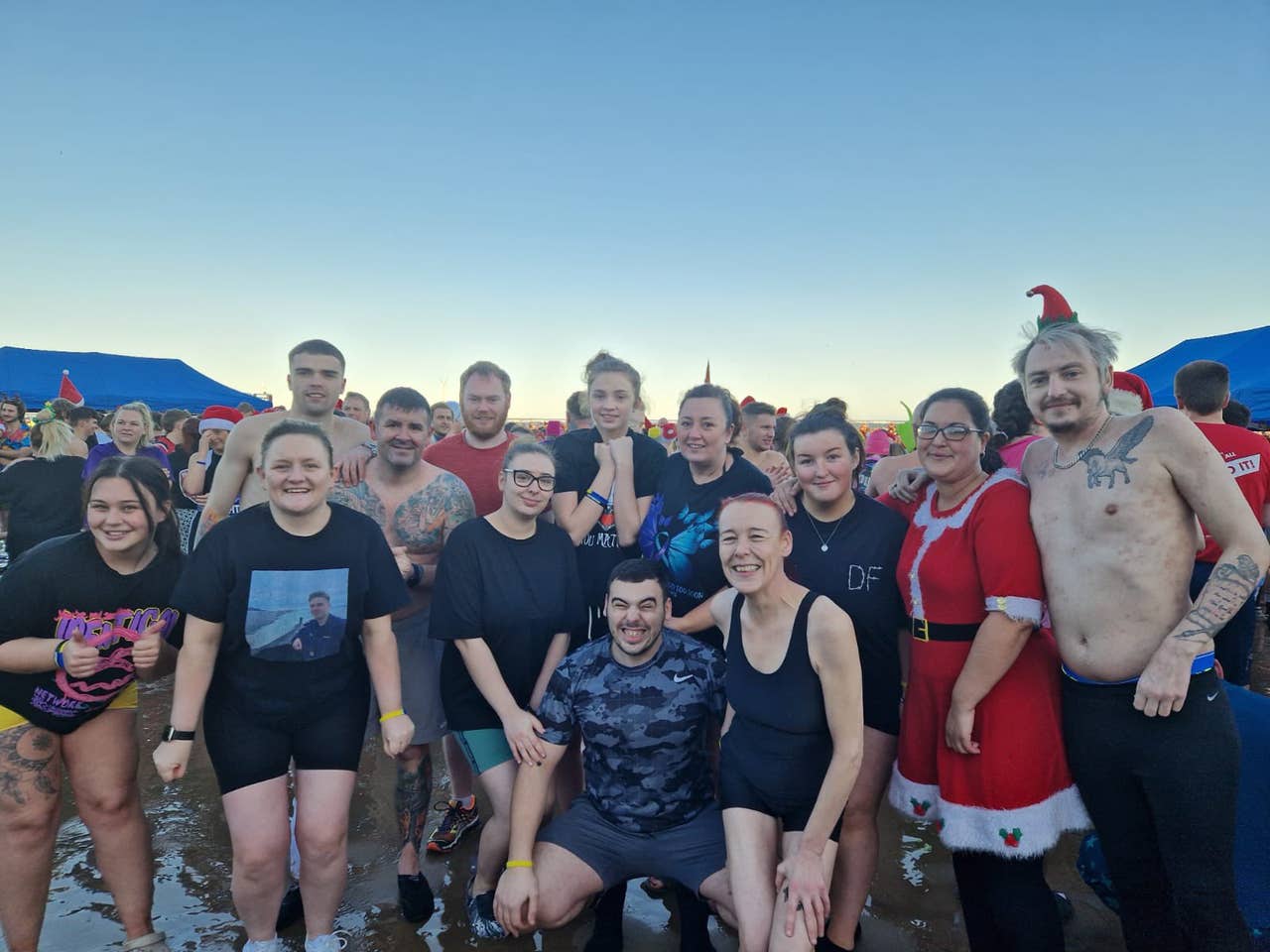 Swimmers don festive outfits for Boxing Day dips for good causes This