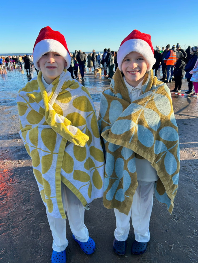 Swimmers don festive outfits for Boxing Day dips for good causes