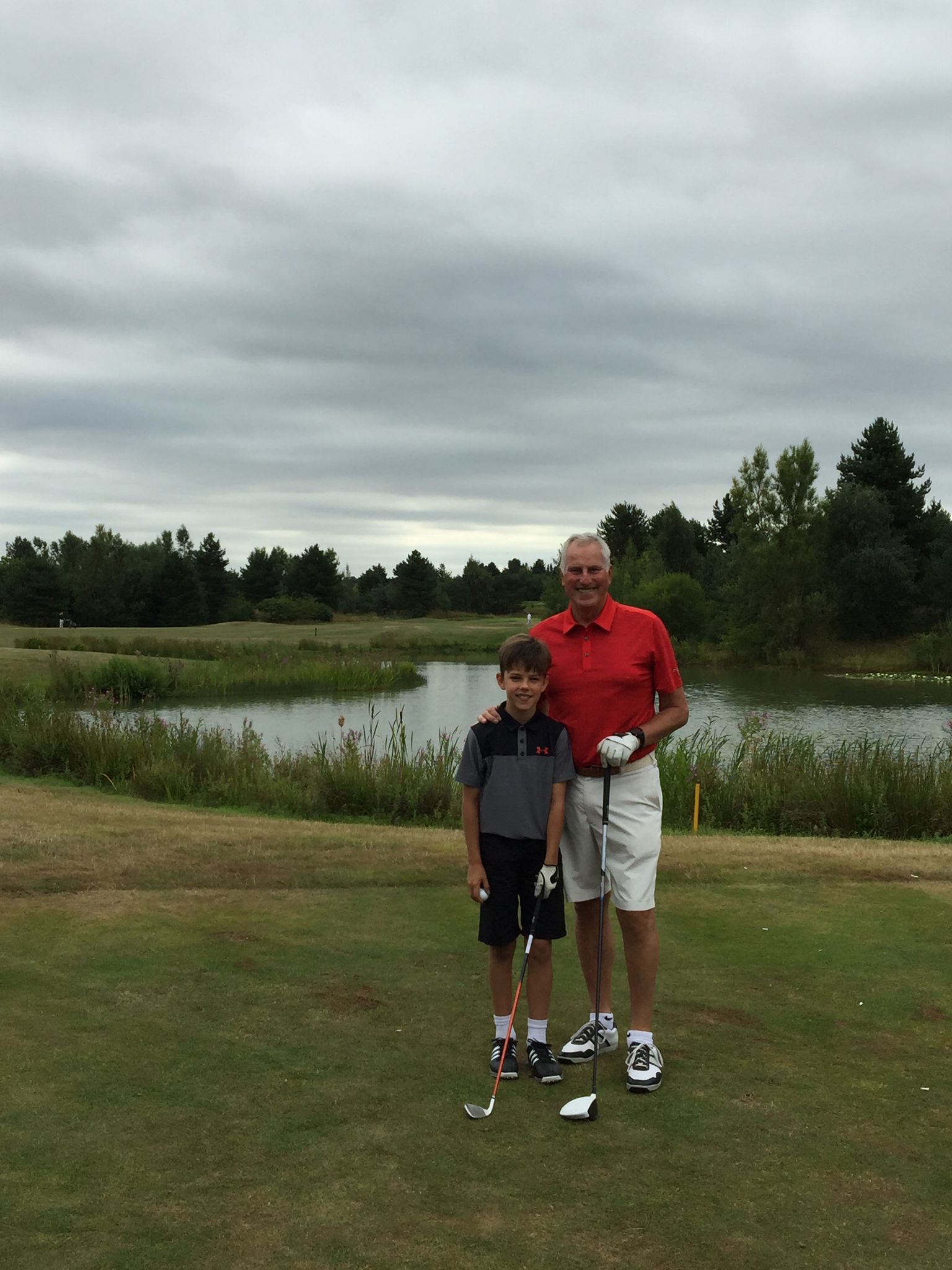 Ray Clemence with his grandson Jack Clemence on a golf course