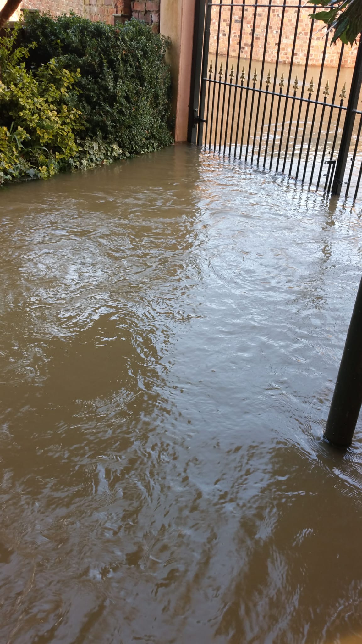 Flood water passing the front gate of Siobhan Connor's property 